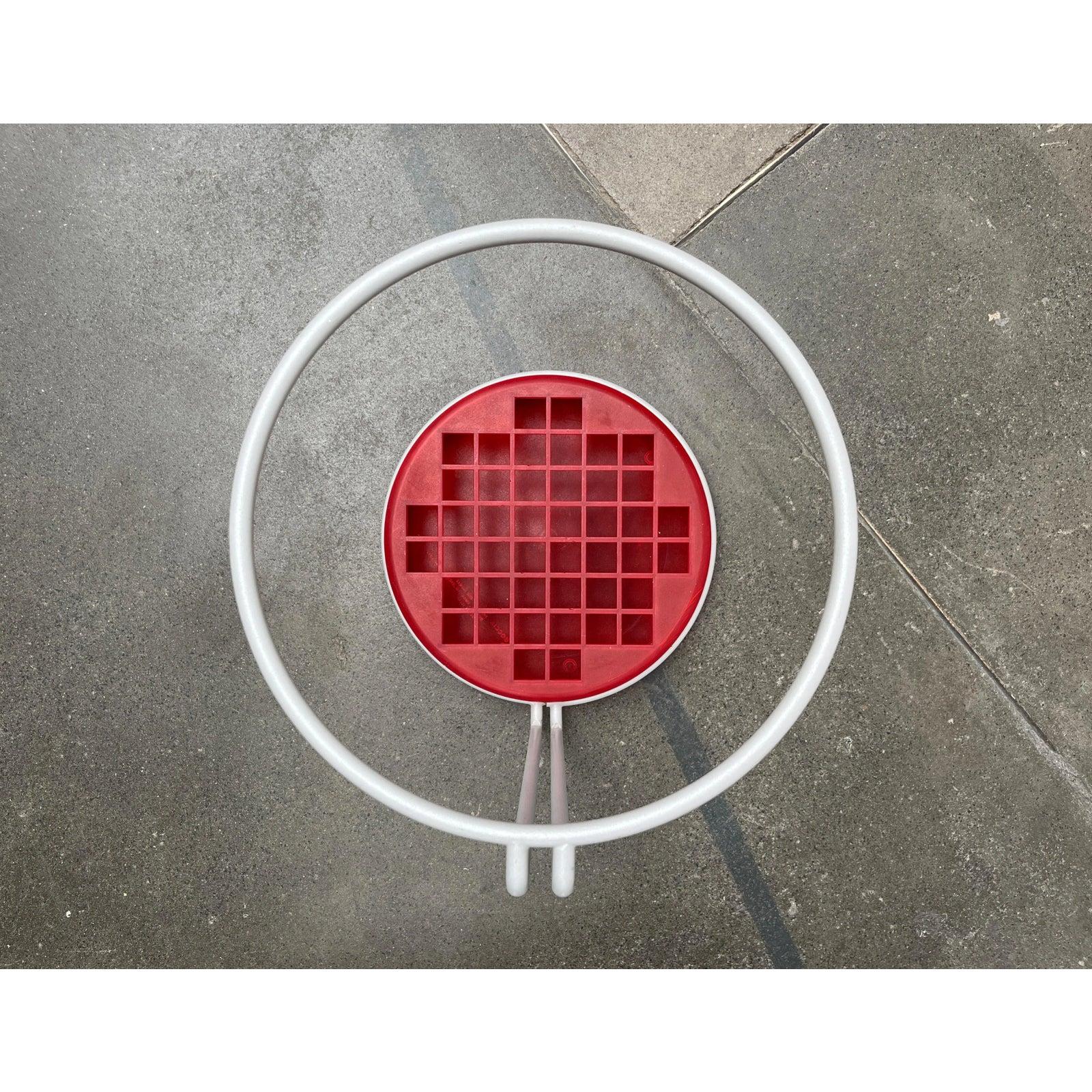 Postmodern umbrella stand by Magis based on a design by Boccato, Gigante and Zambusi Architetti.

Italian umbrella stand of red and gray. The round steel is painted gray and clamps into a base made of translucent red plastic. The finely crafted