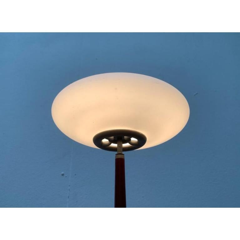 The small T1 table light version from the Pao light series by Matteo Thun.

The Pao shines impress with their characteristic diffuser made of matt glass. However, the material combination made of glass and wood is more special, which make these