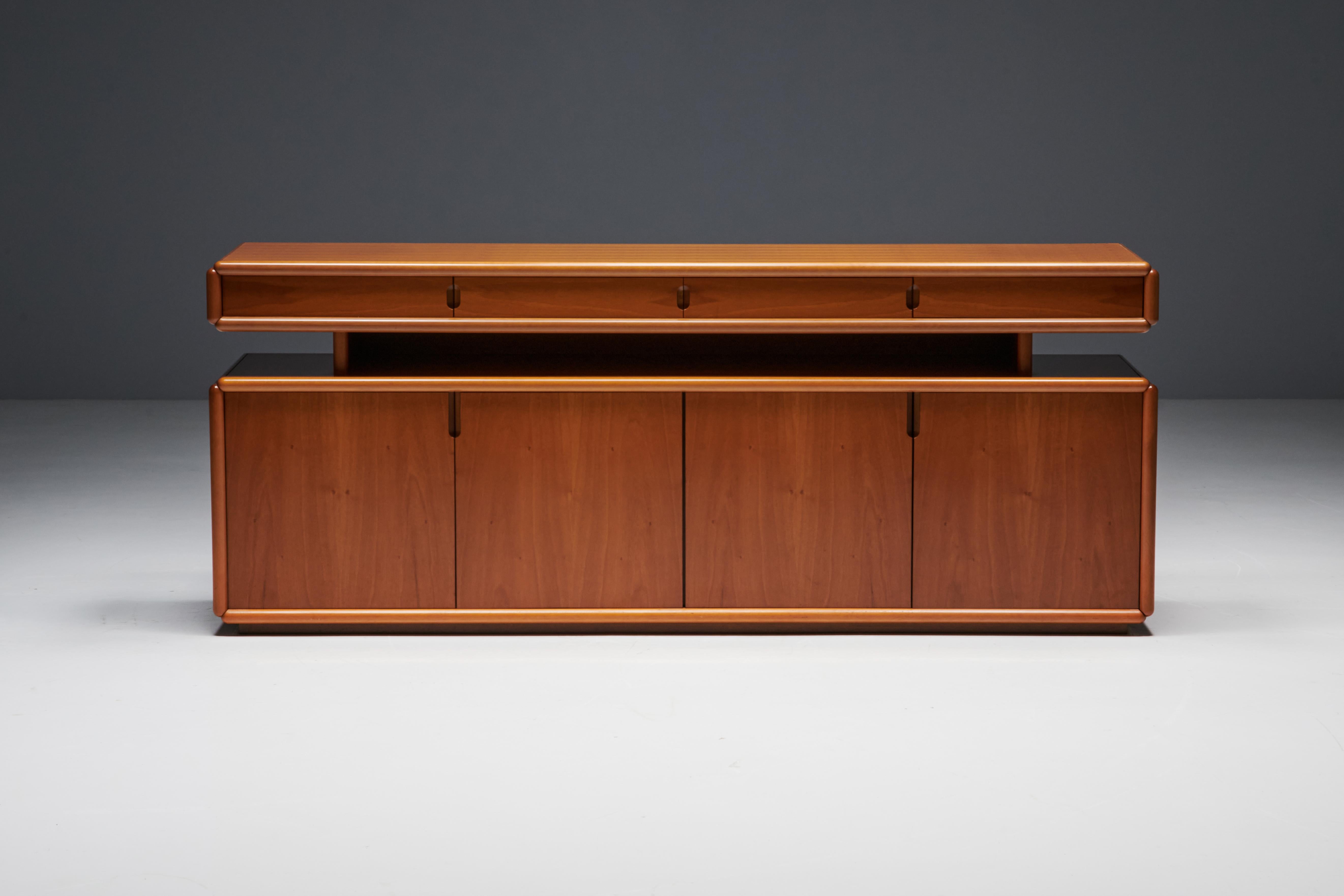 Postmodern Italian sideboard crafted from canaletto walnut and designed in the style of Mario Marenco. In addition to the enchanting beauty of the canaletto walnut patterns, this stunning piece offers ample storage space. The lower section has