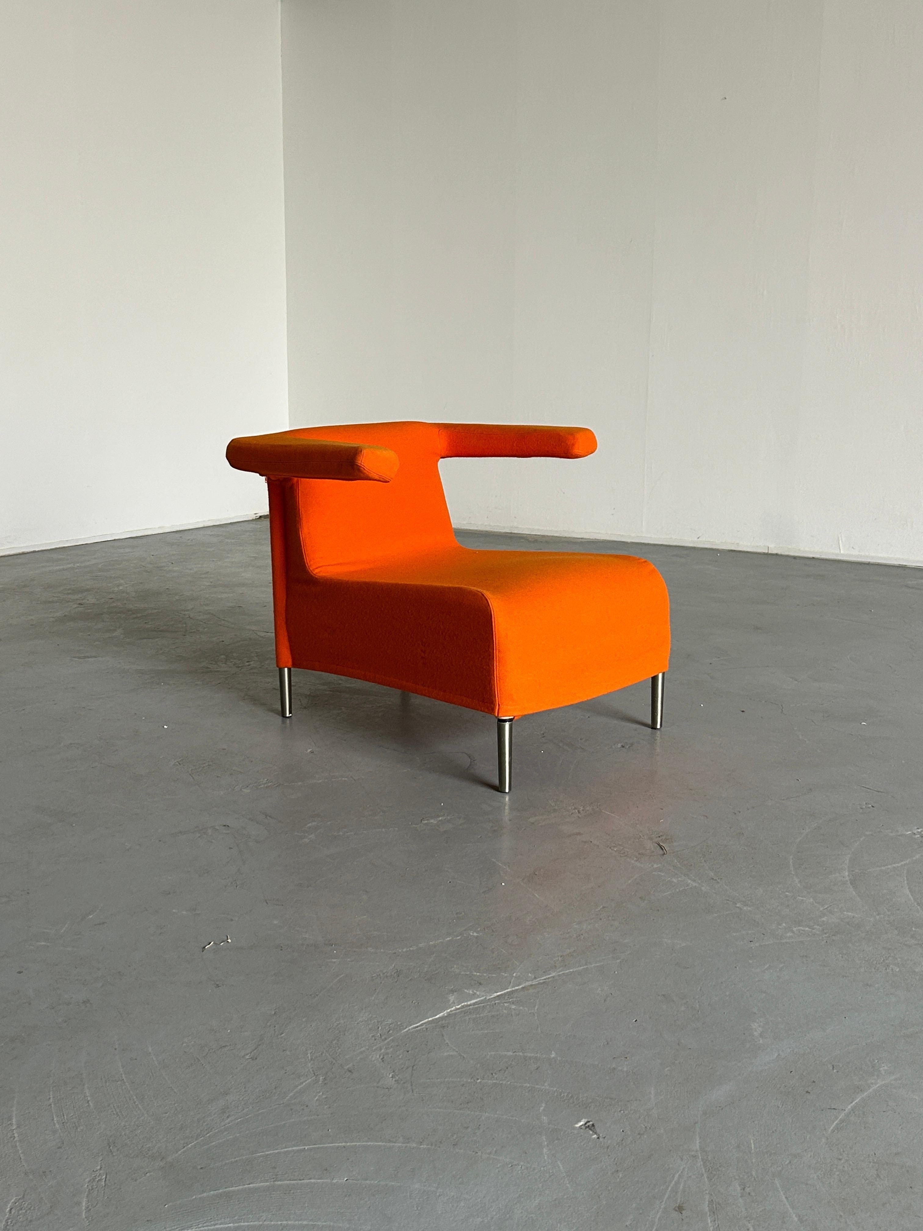 A Memphis-influenced 1990s 'Toribio' Armchair designed by Studio Lievore Altherr Molina for Italian manufacturer Verzelloni, produced in the late 1990s. 

Unique and eye-catching design.

Metal base with legs in matte nickle finish, high density