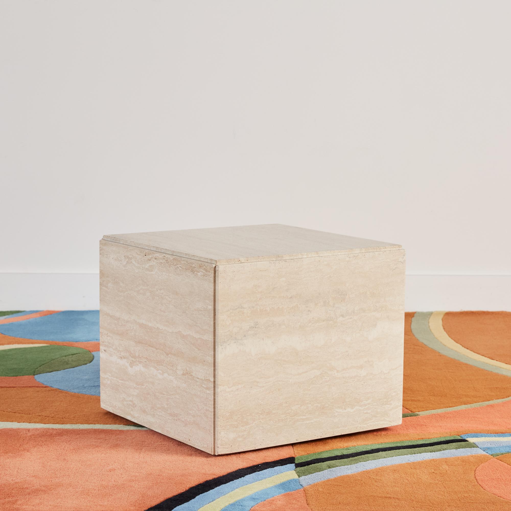 Postmodern travertine cube side table, Italy, c.1980s. This square table sits on casters for easy movability. With a sleek, Minimalist shape that is reminiscent of tables designed by Italian legends Mario Bellini and Angelo Mangiarotti, this