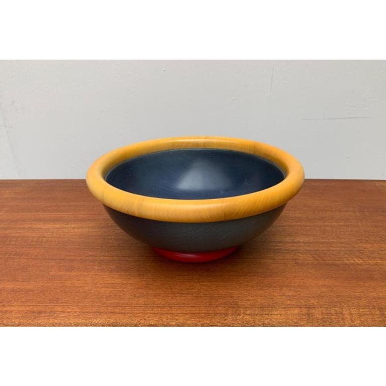 Rare multi-colored wooden bowl by Pietro Manzoni. This large bowl follows postmodern forms and colors. M Branding on the bottom. This piece has an attribution mark.

Additional information:
Materials: Wood
Style: Memphis, Postmodern
Period: