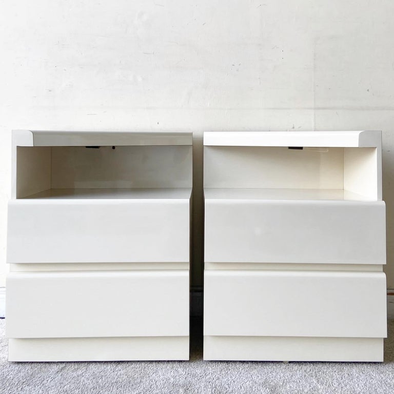 Incredible pair of vintage postmodern nighstands. Each feature two spacious drawers with a lighted section above.
  
