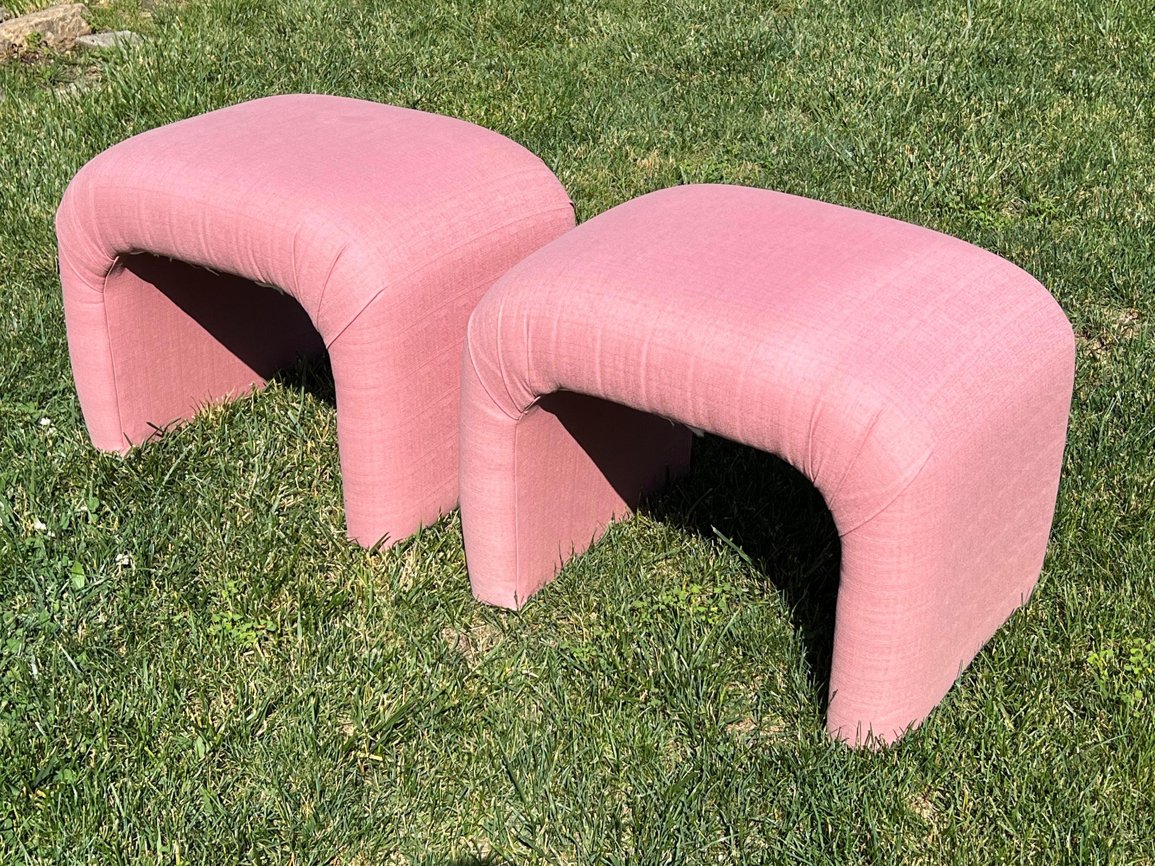 Beautiful mauve pink waterfall stools benches, sell as a pair. They come from an iconic 80s custom contemporary home with lots of pink and pastel color furniture, based in upstate New York.

This pair of stools is in original fabric, which shows