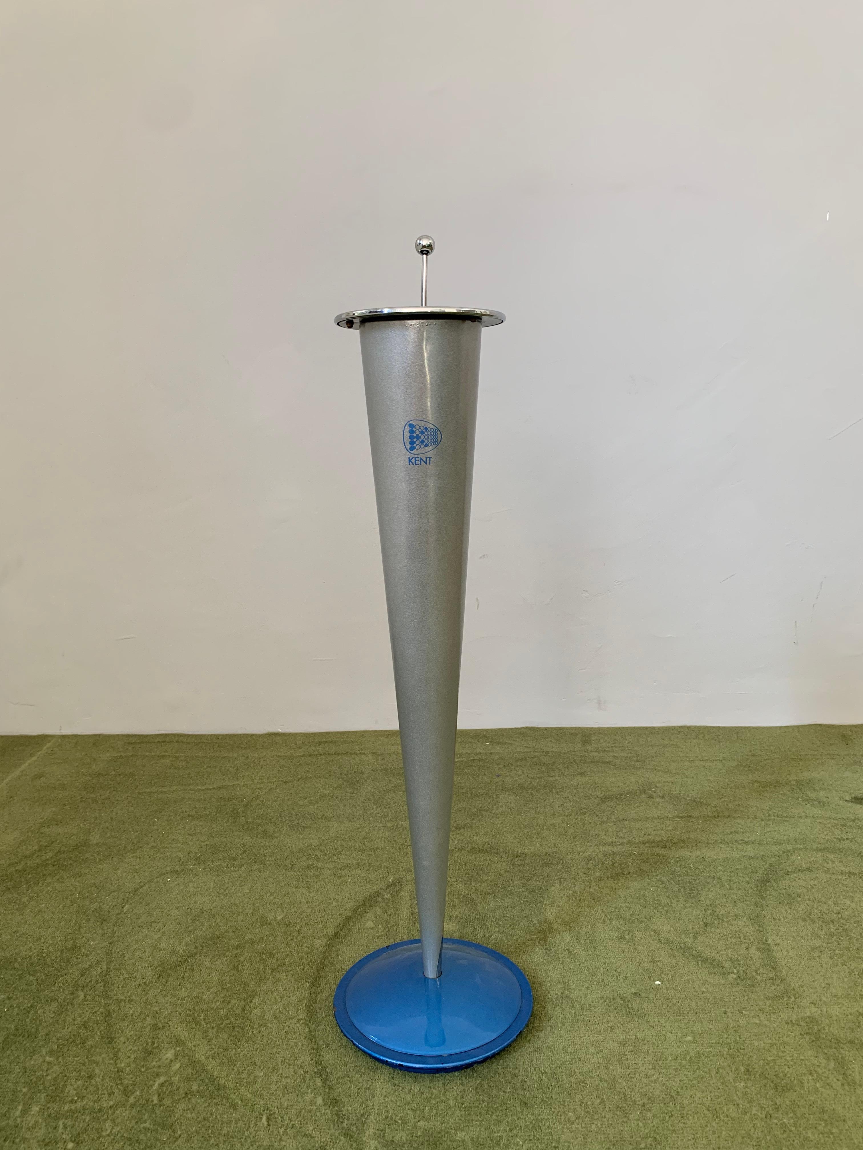 Very unique and extremely rare standing ashtray by the famous American cigarette brand, Kent. 
The height of this cone-shaped object is 70 cm, the maximum diameter is 18 cm. The ashtray is made of steel, the lowest part has a gentle plastic coating