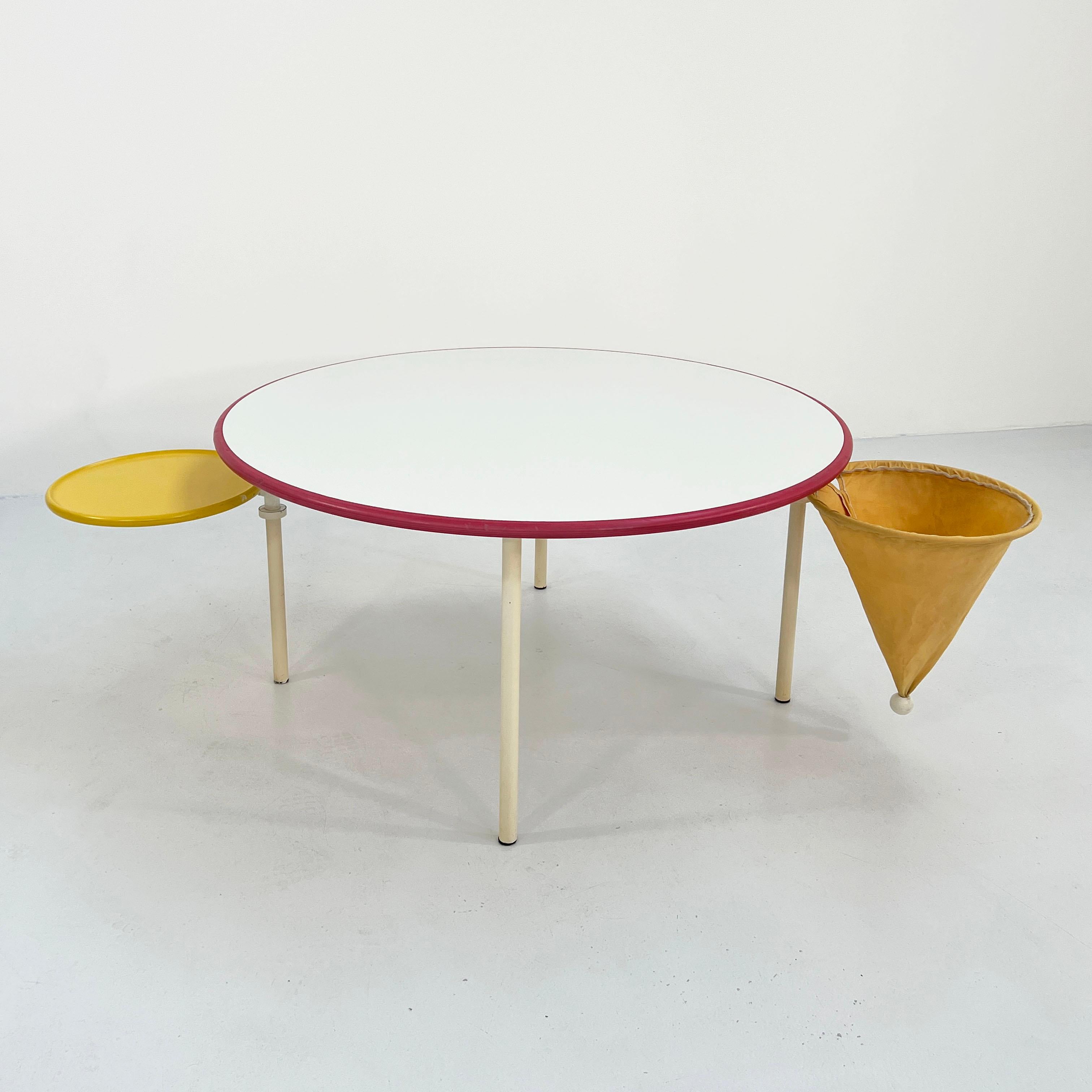 Postmodern Kids Table from Poliform, 1980s
Producer - Poliform
Design Period - Eighties 
Measurements - width 120 cm x depth 120 cm x height 60 cm
Materials - Wood, Metal, Plastic
Color - Red, Yellow, White
??????Condition - Good 
Comments -