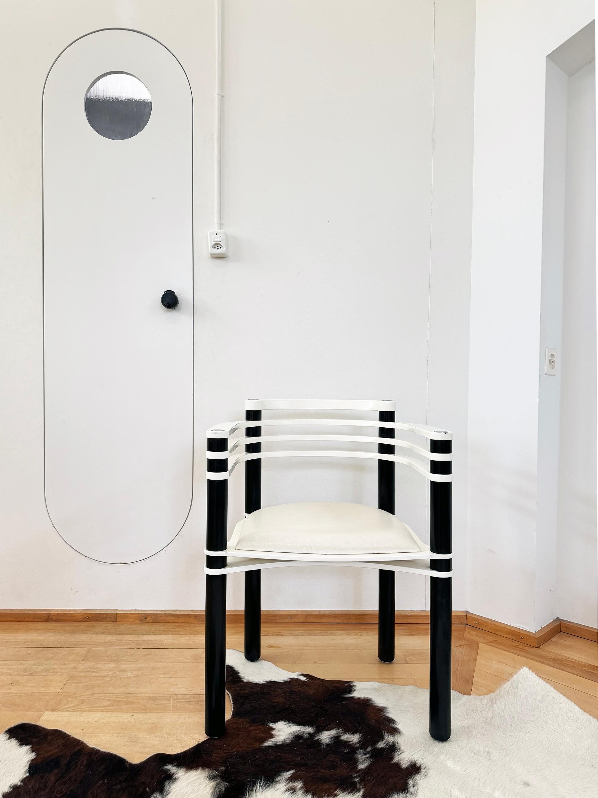 Gorgeous pair of Postmodern Memphis 80s chairs by Kurt Thut for Dietiker. NOTE: We have two sets available, sold in pairs here. We also have one single chair available.

The chair features a unique combination of materials, with a wooden frame that