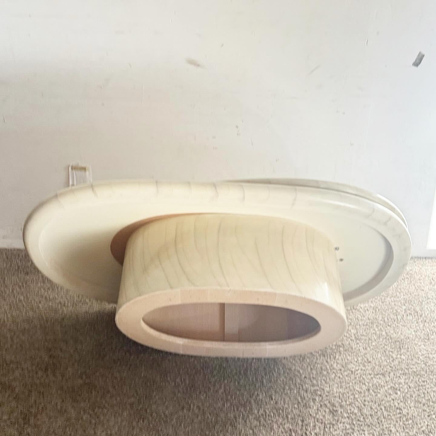 20th Century Postmodern Lacquered Faux Stone Swivel Top Oval Coffee Table For Sale