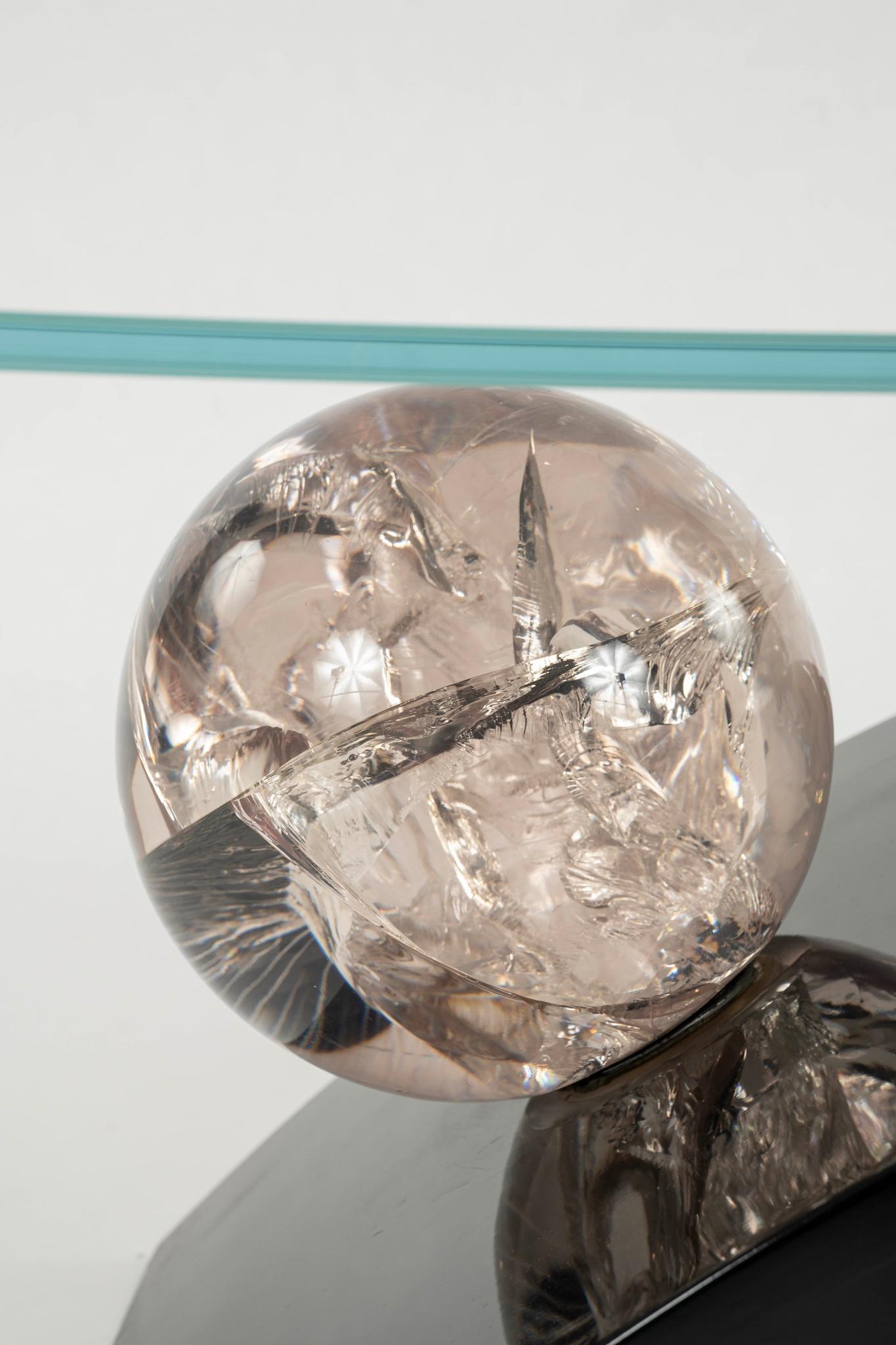 1980s postmodern cocktail table with a black lacquered wood base, lucite sphere and a new glass top.