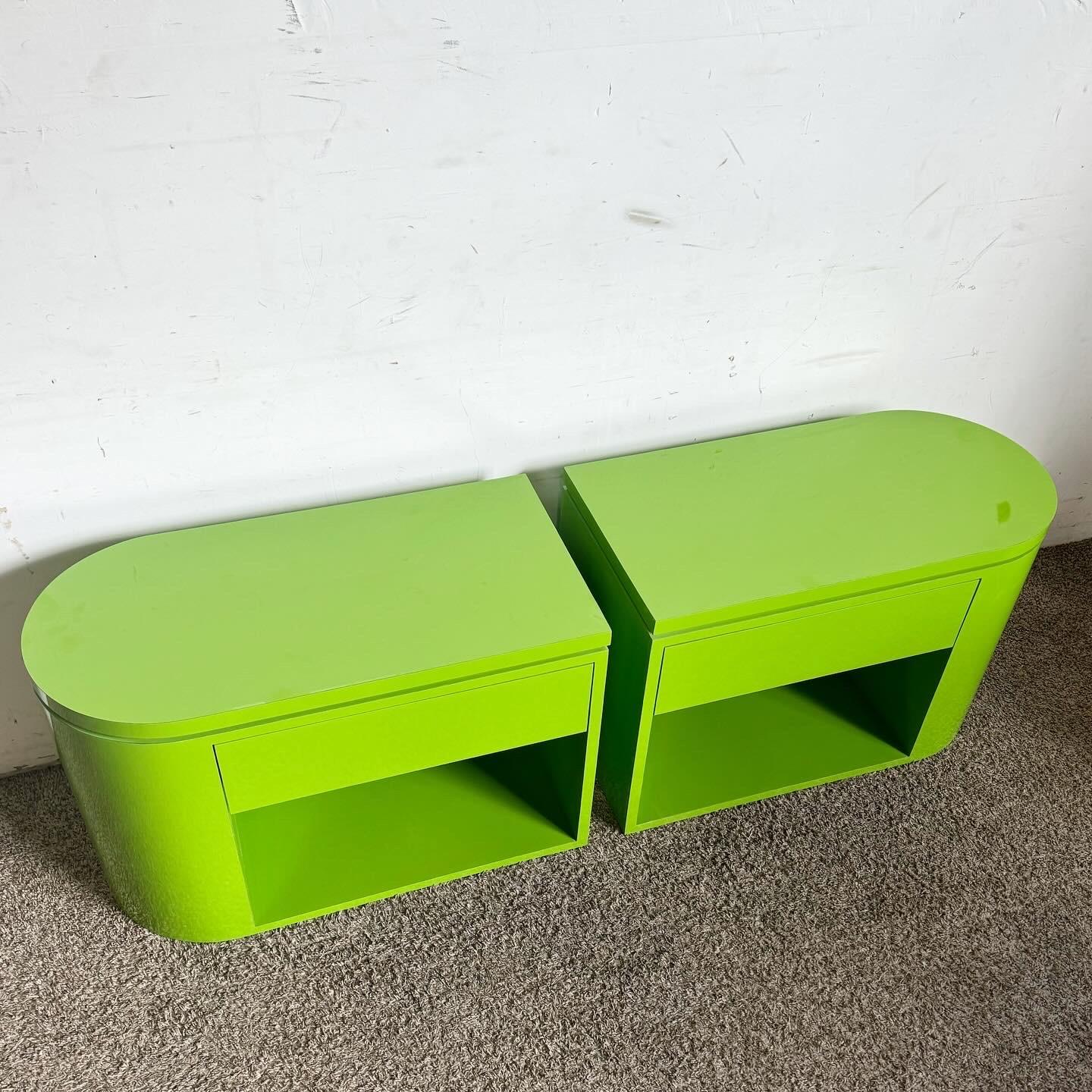 Inject a bold pop of color into your home with this pair of Postmodern Lime Green Lacquer Laminate End Tables/Nightstands. Featuring a vibrant lime green finish, these tables are perfect for any room needing a touch of modern flair. Their sleek