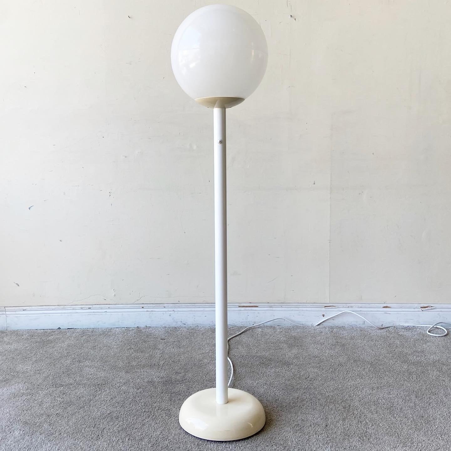 Amazing postmodern lollipop floor lamp. Features a spherical plastic shade.
   