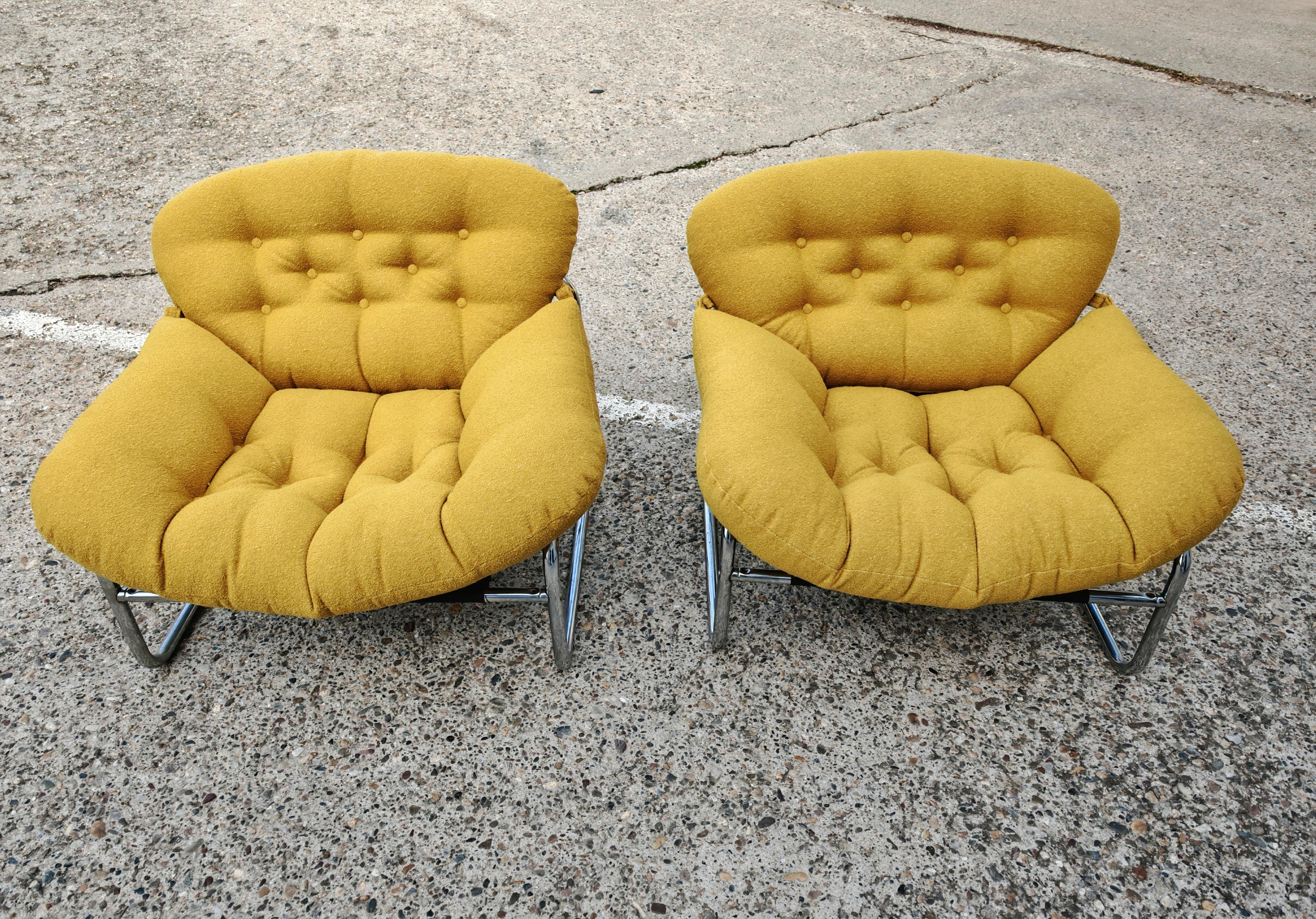In this listing you will find a pair of Postmodern Lounge Chairs designed by Johan Bertil Häggström for Swed Form. The chair features a Bauhaus-style tubular chrome frame with a fluffy, large seat upholstered in mustard bouclè, which makes these