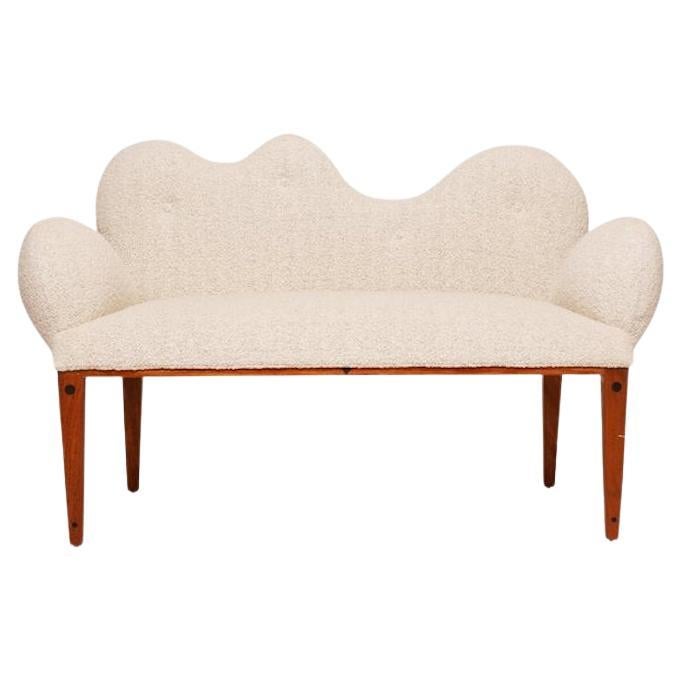 Postmodern loveseat by Joaquin Gasgonia for Balaico Arete-Ugma reupholstered in an ivory Dedar Milano wool boucle.