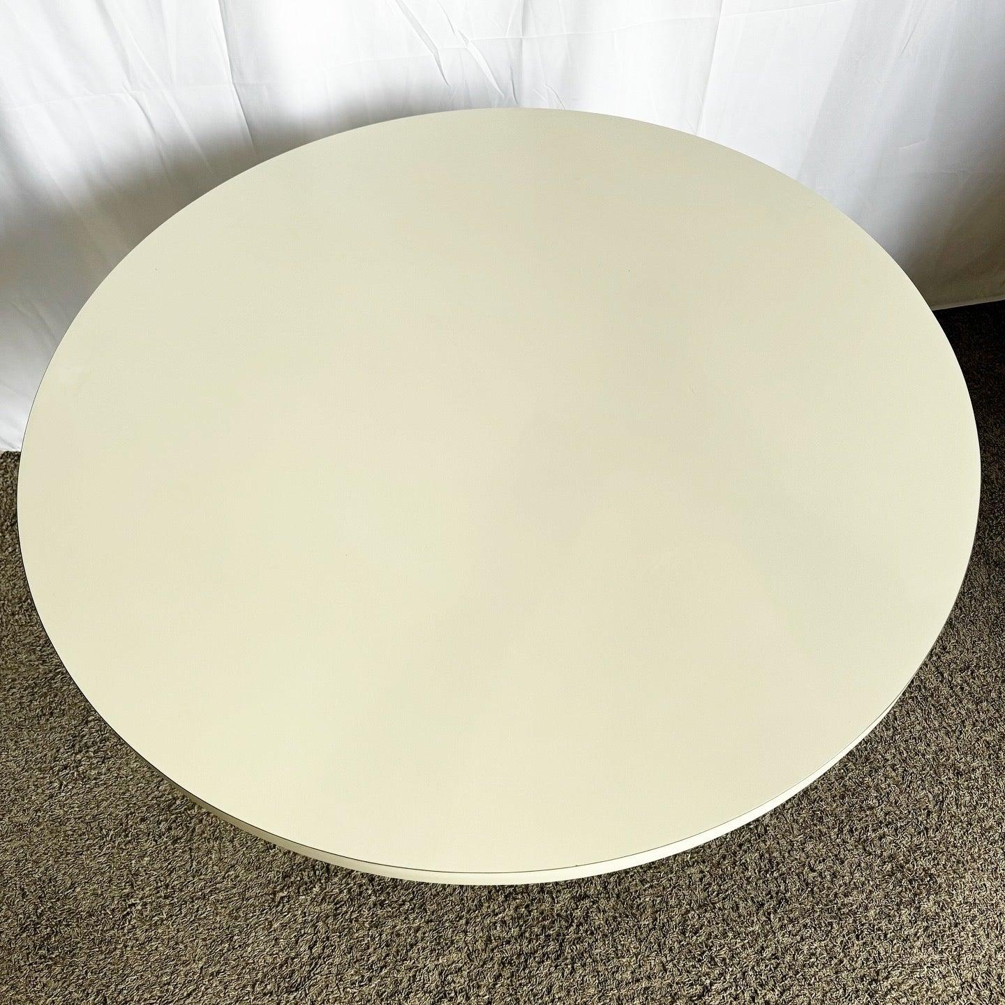 Elevate your dining area with this Postmodern Lucite and Laminate Dining Table, featuring a circular white top and sculptural base.
 
 Very minor wear as shown in the photos.
 
 We sell items as acquired, without restoring or repairing. Vintage