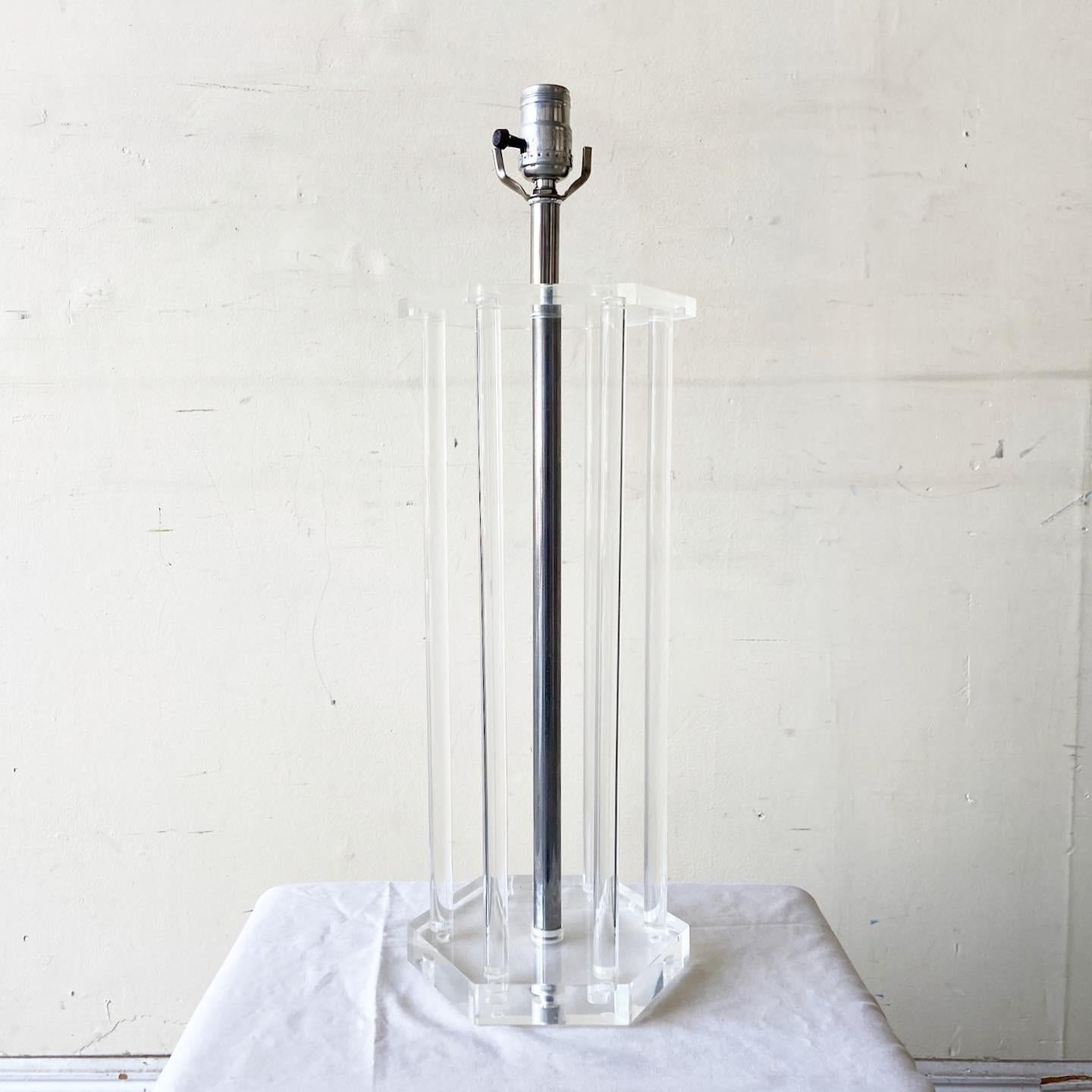 Exceptional Mid-Century Modern lucite table lamp. Features a fantastic hexagonal body framed by lucite columns.
 