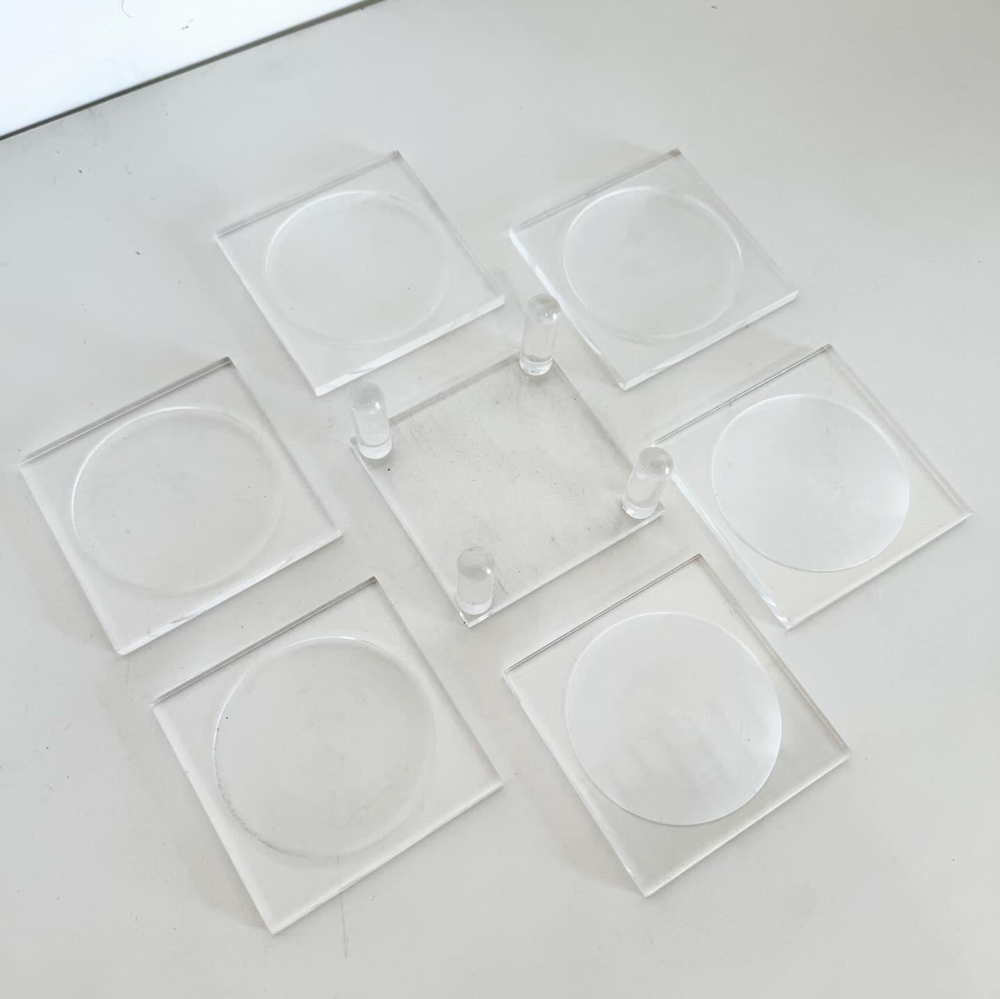 Discover the minimalist elegance of a Postmodern Lucite Coaster Set with Holder, featuring 6 sleek coasters perfect for contemporary homes. These durable, clear Lucite coasters blend sophistication with functionality, offering a stylish solution to