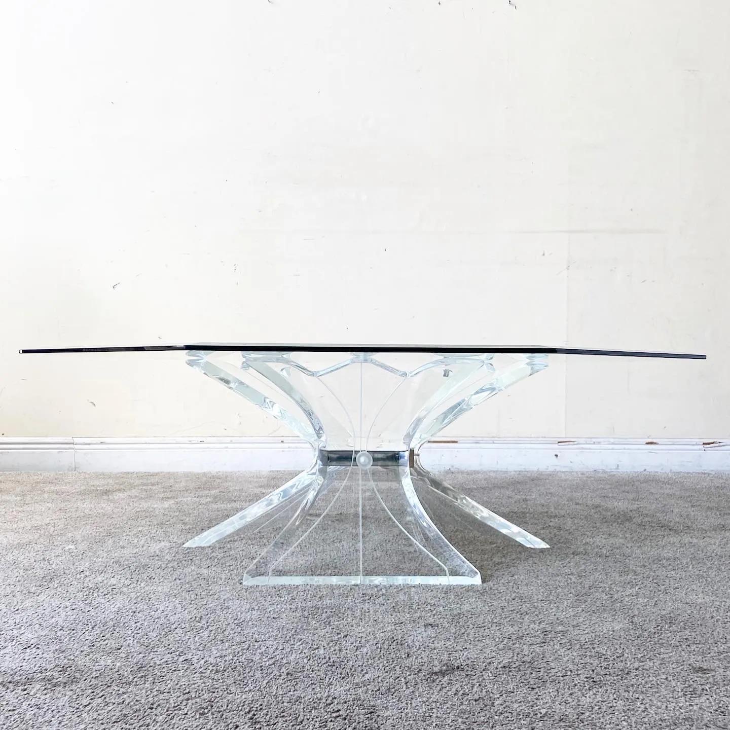 Exceptional postmodern beveled glass top octagonal coffee table. Features a lucite bouquet pedestal base with a central mirror.

Additional information:
Materials: Glass, Lucite
Color: Transparent
Style: Postmodern
Time Period: 1980s
Place of