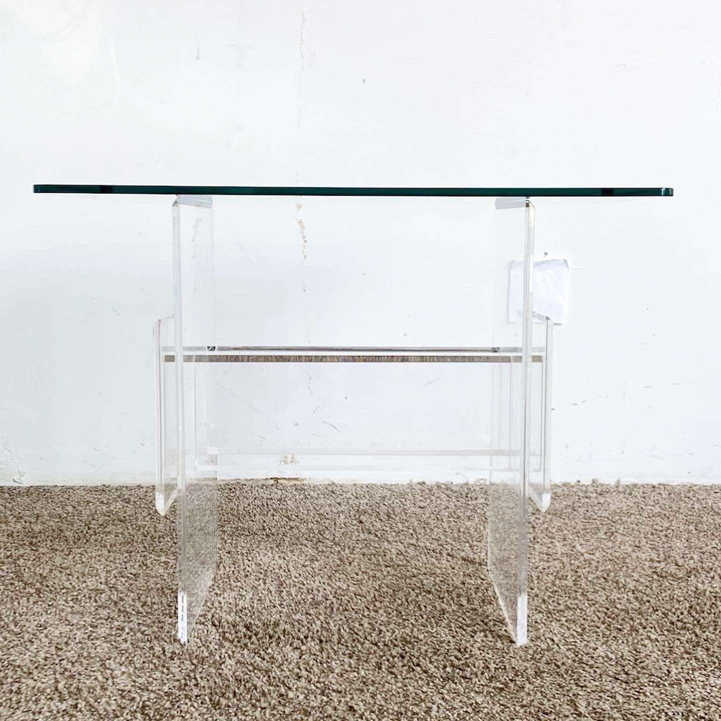 Amazing vintage postmodern lucite side table. Features a beveled glass top.