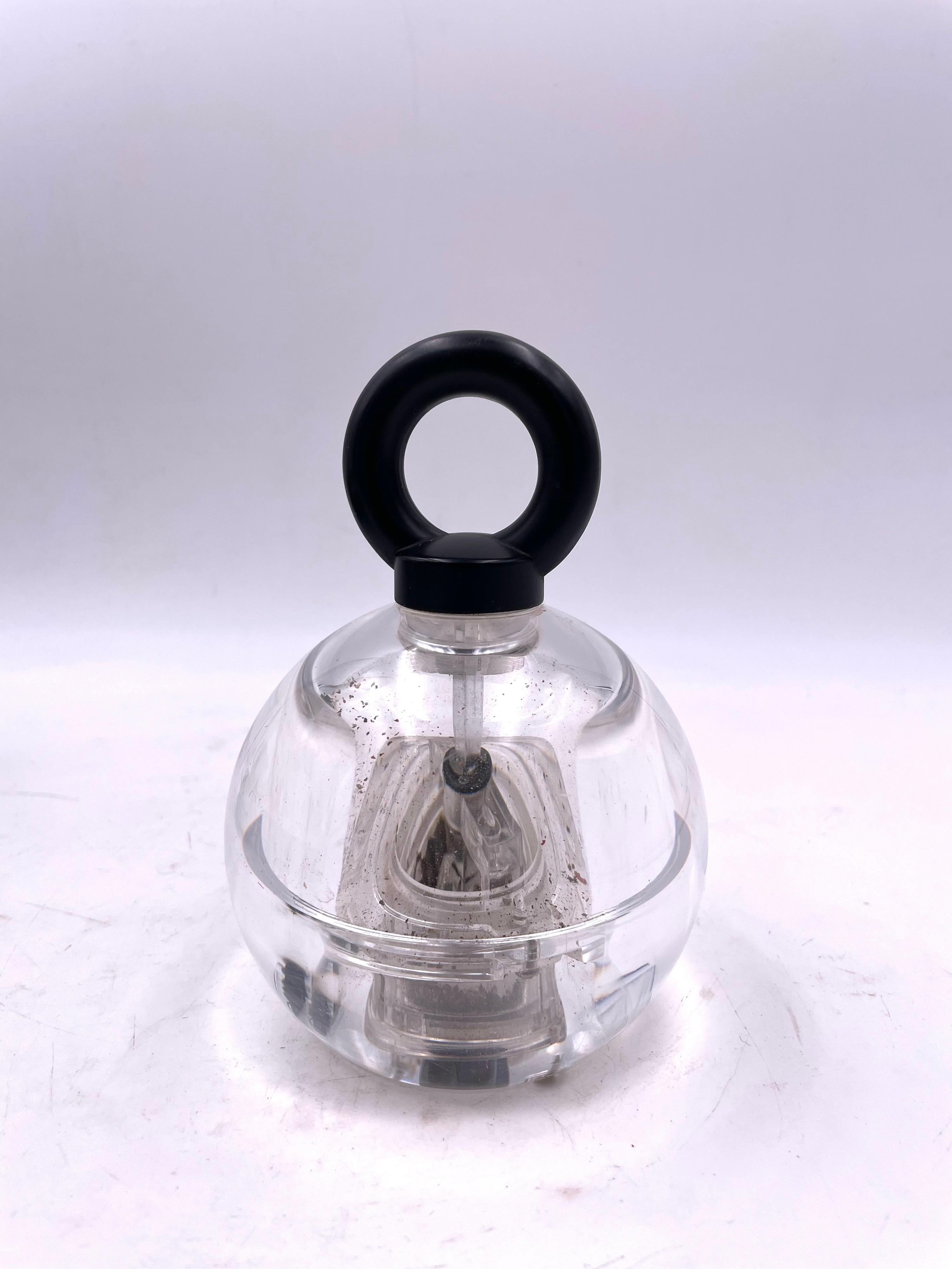 A rare 1980's lucite ball pepper grinder with a metal mechanism designed by Richard Nissen for Bodum.