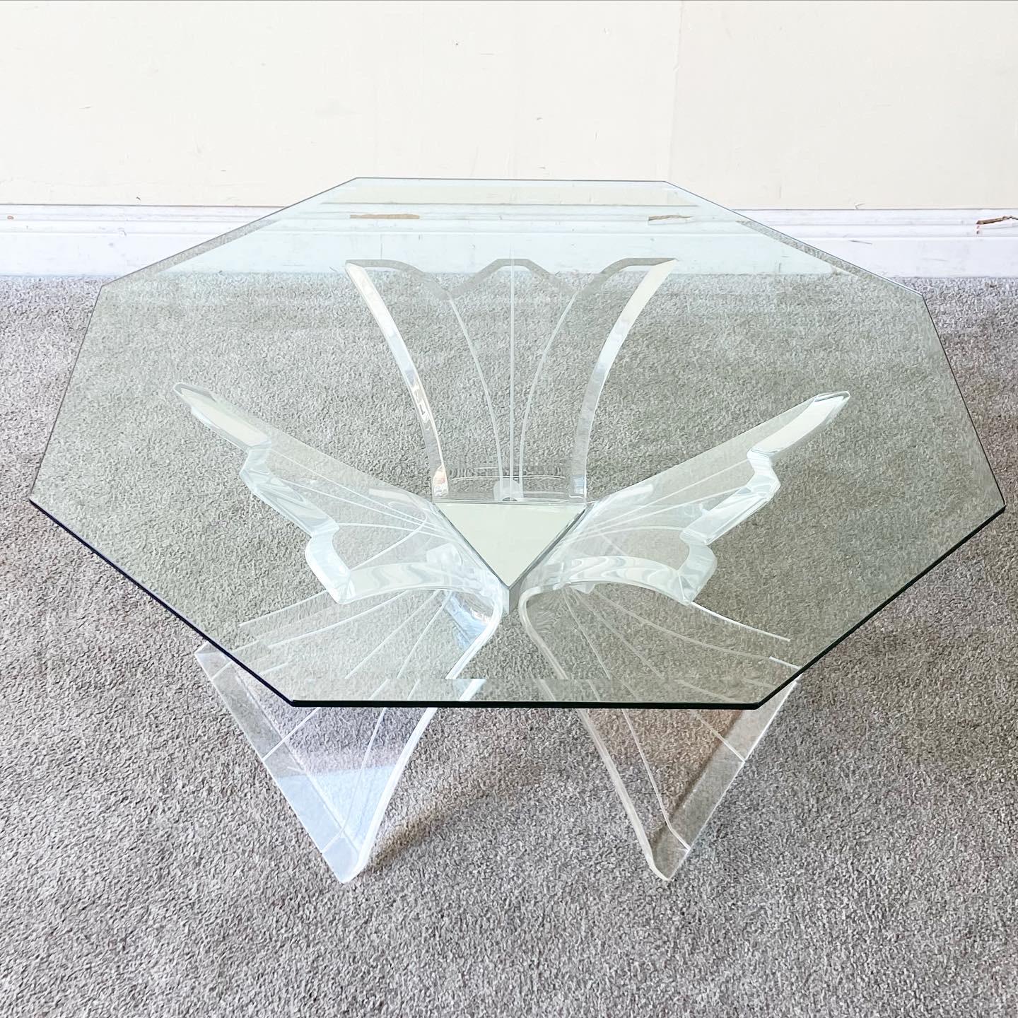 Incredible postmodern lucite base coffee table. Features a beveled octagonal glass top.

Additional information:
Material: Glass, Lucite
Color: Transparent
Style: Postmodern
Time Period: 1980s
Dimension: 38ʺ W × 38ʺ D × 15.75ʺ H