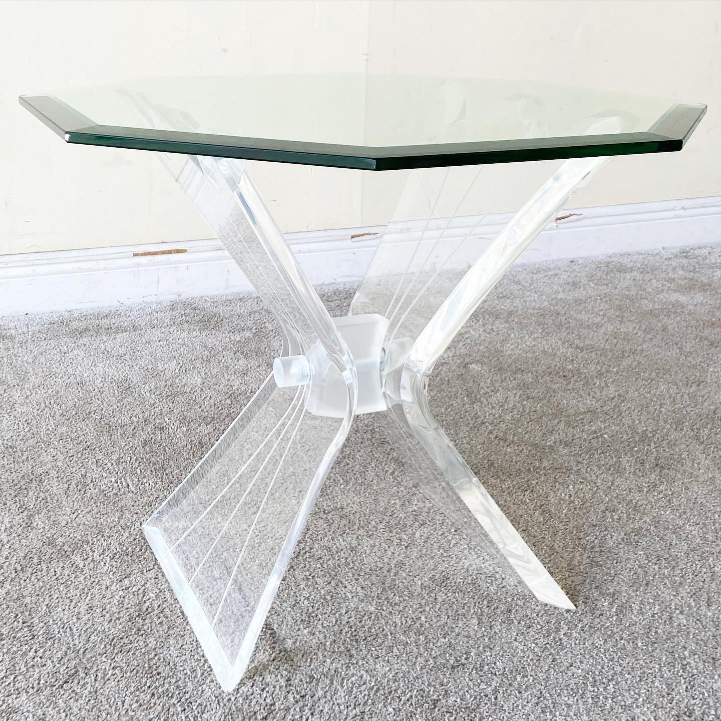 Amazing postmodern lucite side table. Features a beveled octagonal glass top.

Additional information:
Material: Glass, Lucite
Color: Transparent
Style: Postmodern
Time Period: 1980s
Dimension: 24
