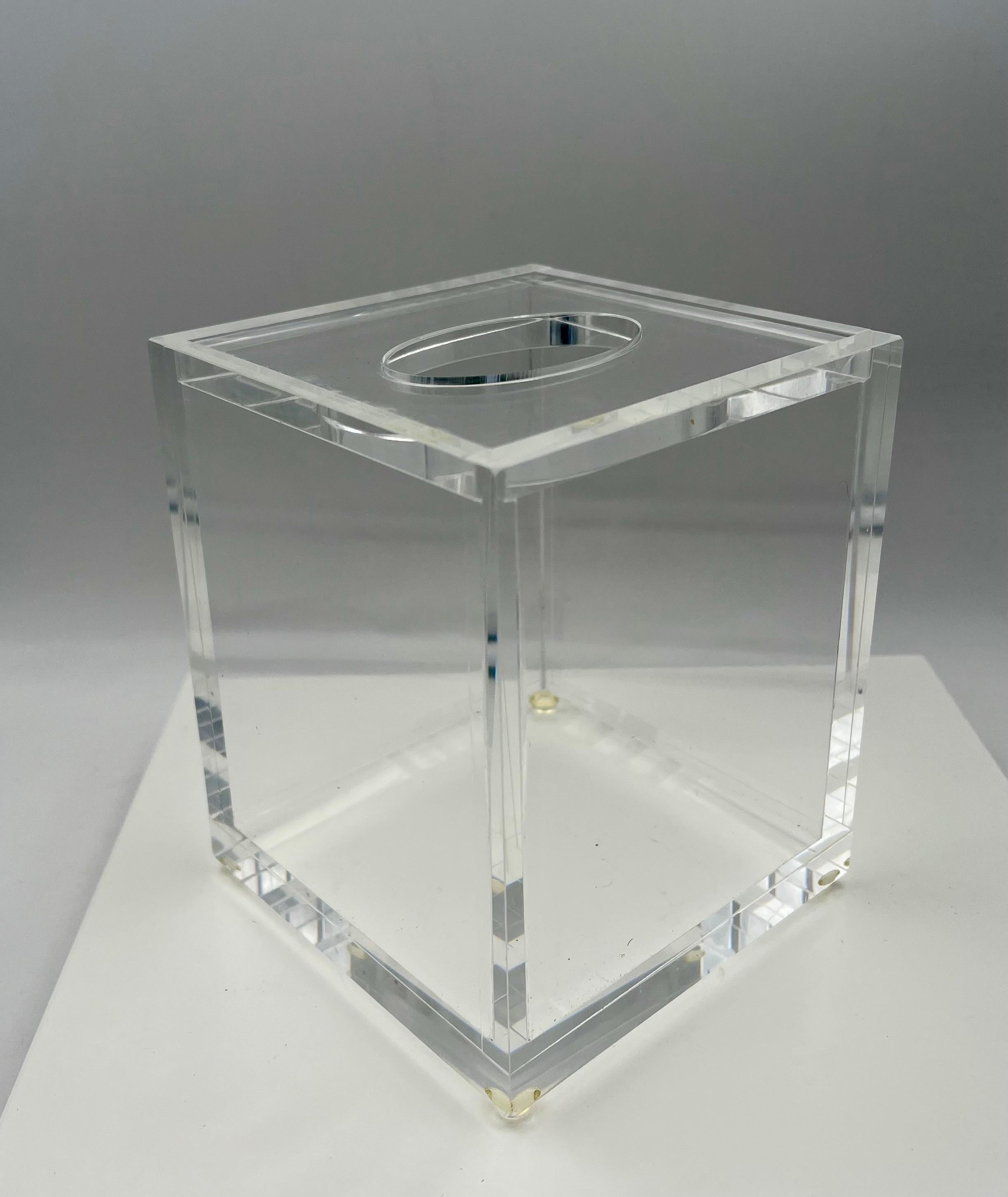 l Beautiful solid lucite tissue box in the style of Charles Hollis Jones, circa the 1980s. The piece is in excellent condition no chips or scratches very light wear and little rubber feet.