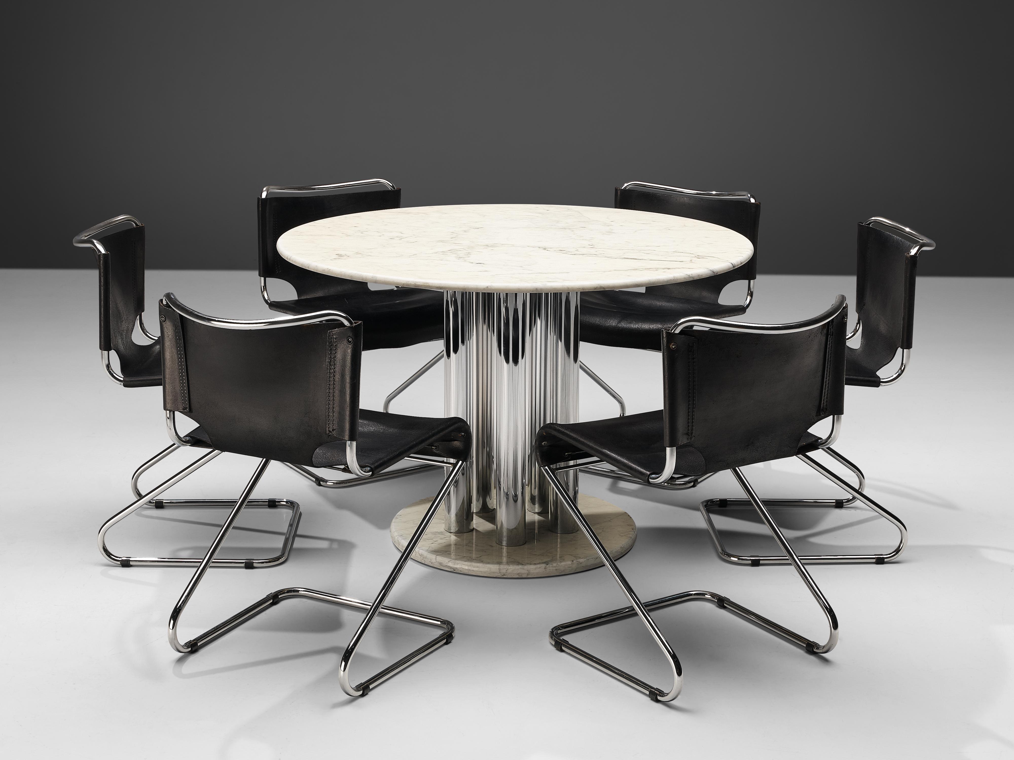 Italian dining table, marble, metal, Italy, 1980s
This wonderful example of Italian postmodern design shows an exciting combination of materials, textures and shapes. A round tabletop in white marble is echoed by a round foot in smaller size.