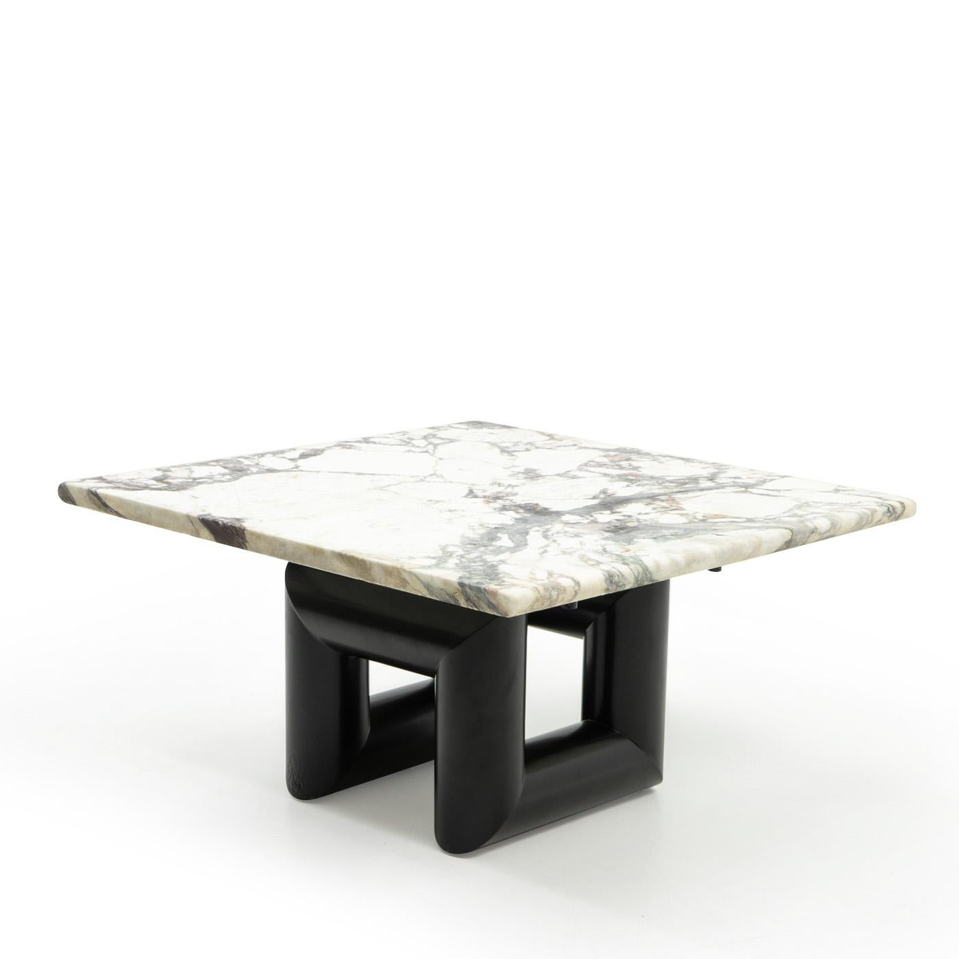 Custom designed coffee table by Mario Botta, produced by Alias (Italy) for the Ransila Building 1, Lugano, Switzerland:

This marble top coffee table is an adjustment of the serie-produced Terzo dining table (1980s) specifically designed for use in