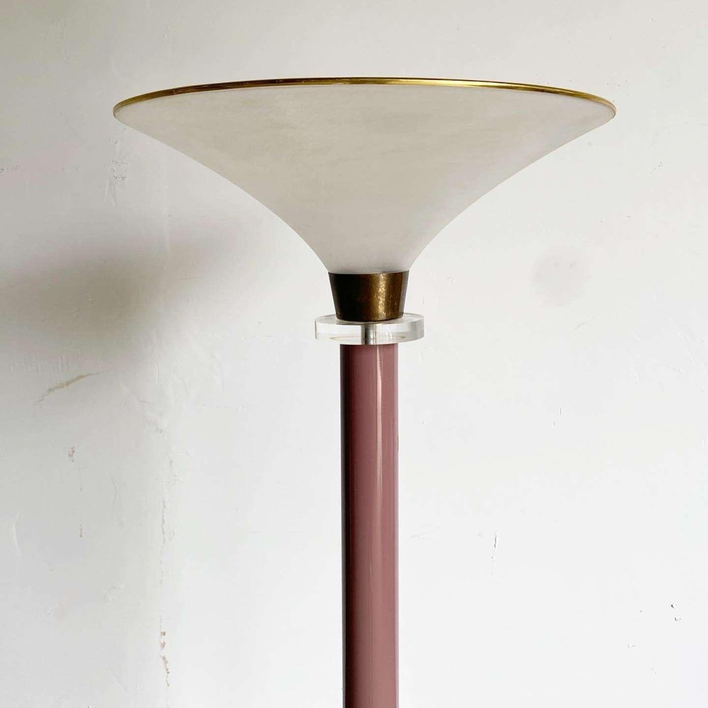 Exceptional vintage postmodern floor lamp. Features a mauve stem with stacked lucite and brass accents.