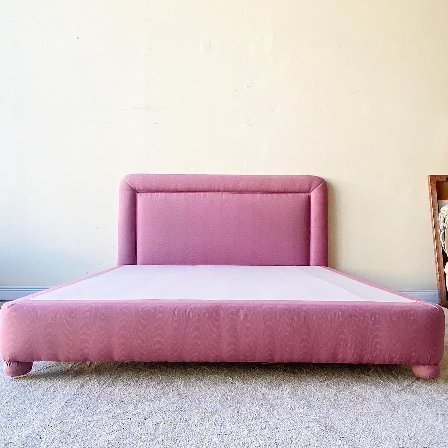 Extravagant vintage 1980s postmodern mauve pink king size platform bed. Included is a matching headboard.

Bed frame measures 78”W, 81”D, 13.5”H
Headboard measures 78”W, 3.5”D, 47”H.
