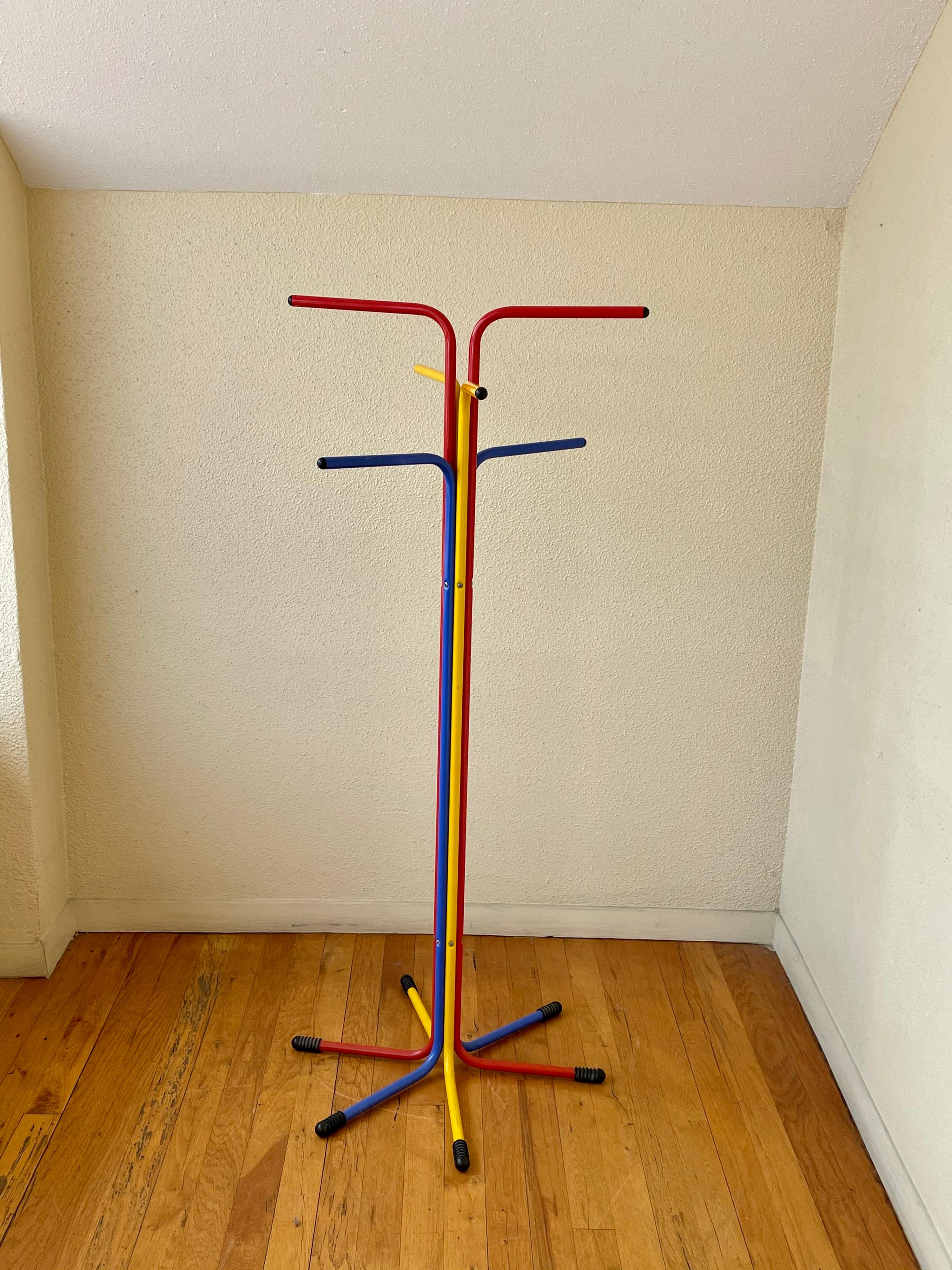 Colorful enameled tubular metal Italian coat rack circa 1980s, Classic Memphis era design with rubber feet and end tips.