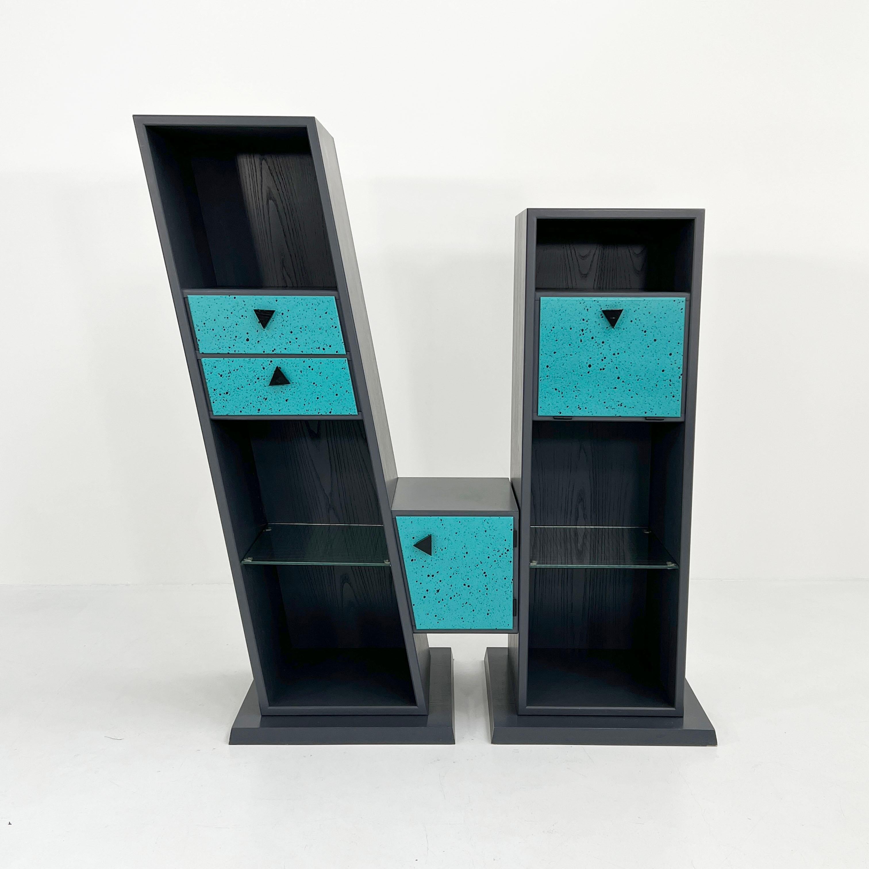 Design Period - Eighties
Measurements - Width 133 cm x Depth 52 cm x Height 144 cm 
Materials - Laminated, Metal 
Color - Grey, blue, purple
Light wear consistent with age and use. 3 chips on the edges at the back - see pictures of the details.