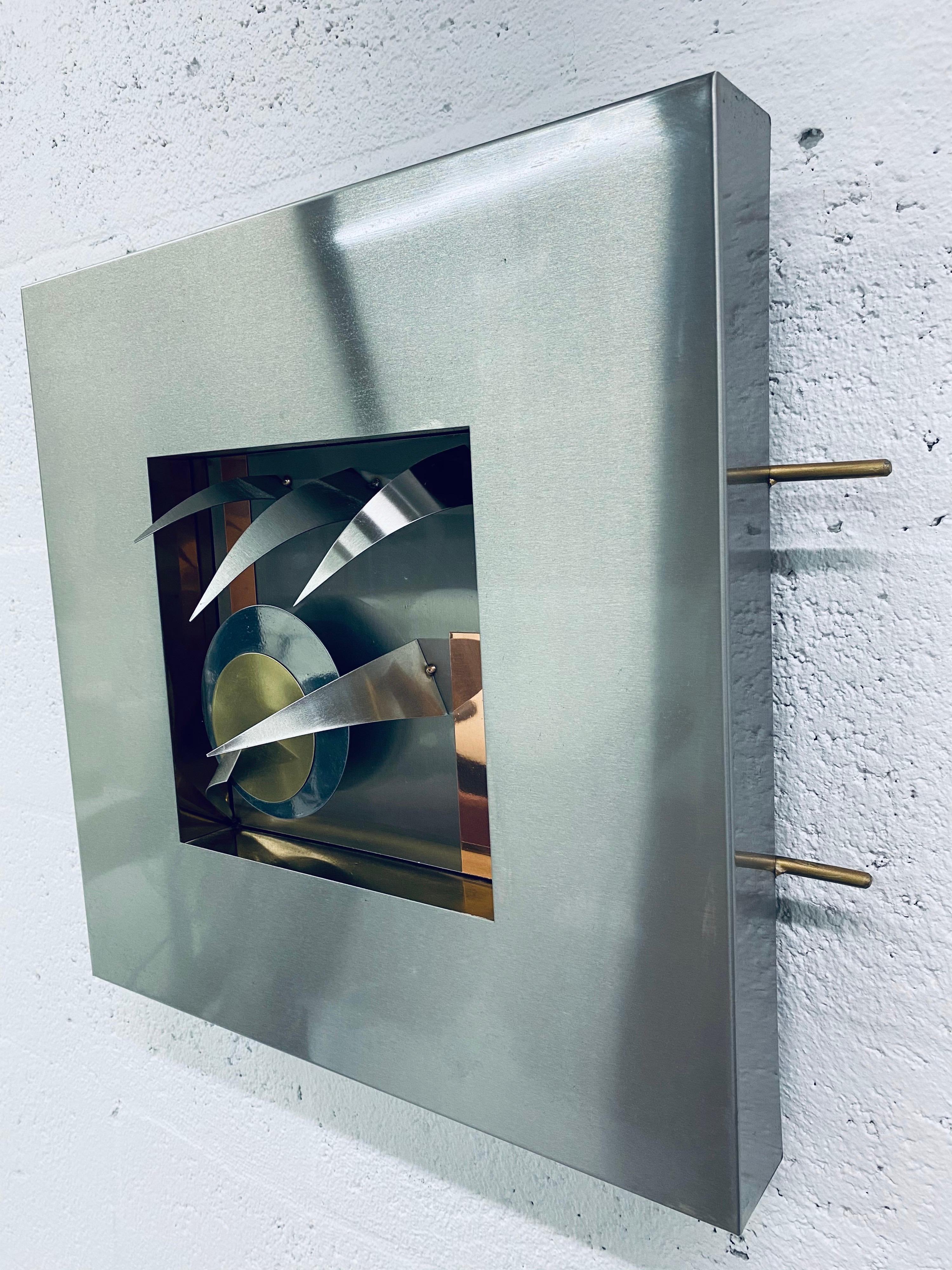 Dimensional mixed metal walls sculpture with aluminum box frame circa 1980s. There are 4 available sculptures with different designs.