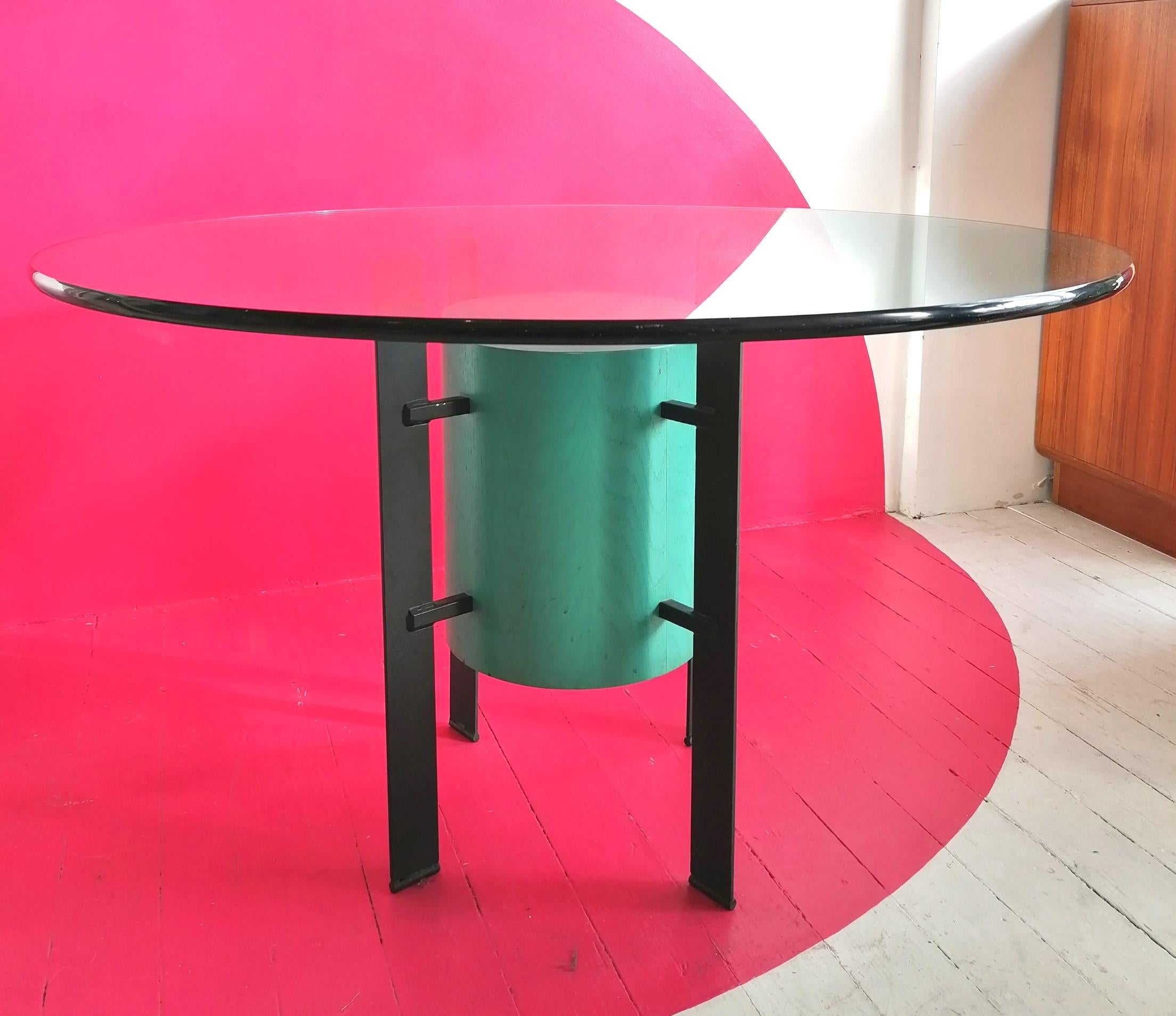 Postmodern Memphis style dining table, USA, 1980s.
Black powder-coated steel or Iron, seafoam-coloured plywood centre, 20mm thick glass top.

 

Dimensions : diameter 122cm, height 74.5cm
