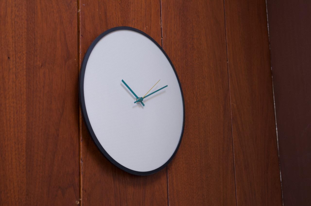 1980s Italian minimal glass-fronted wall clock in the Memphis style by 