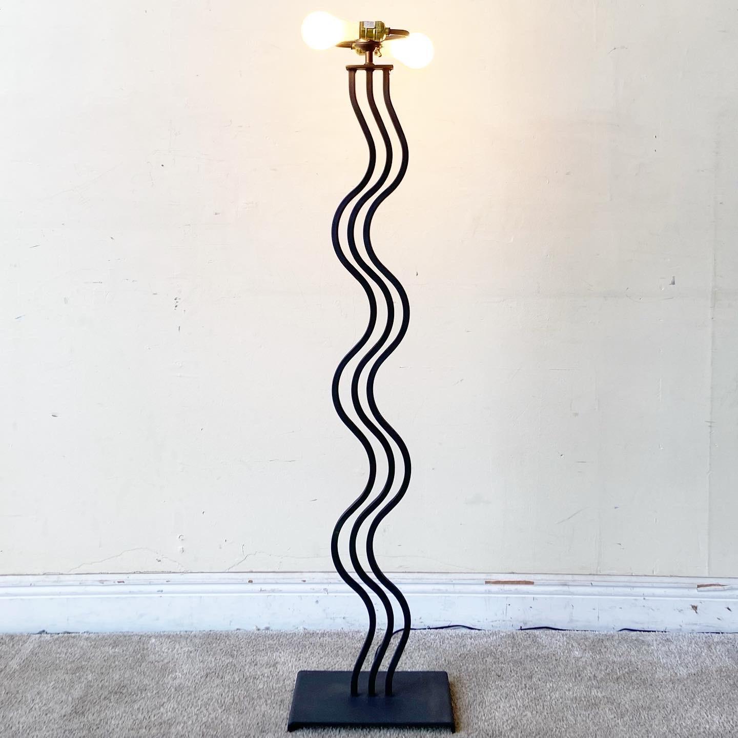1980s Postmodern Memphis style floor lamp. Sculptural design features a series of curved metal bars in a powder coated matte black finish.

One way lighting