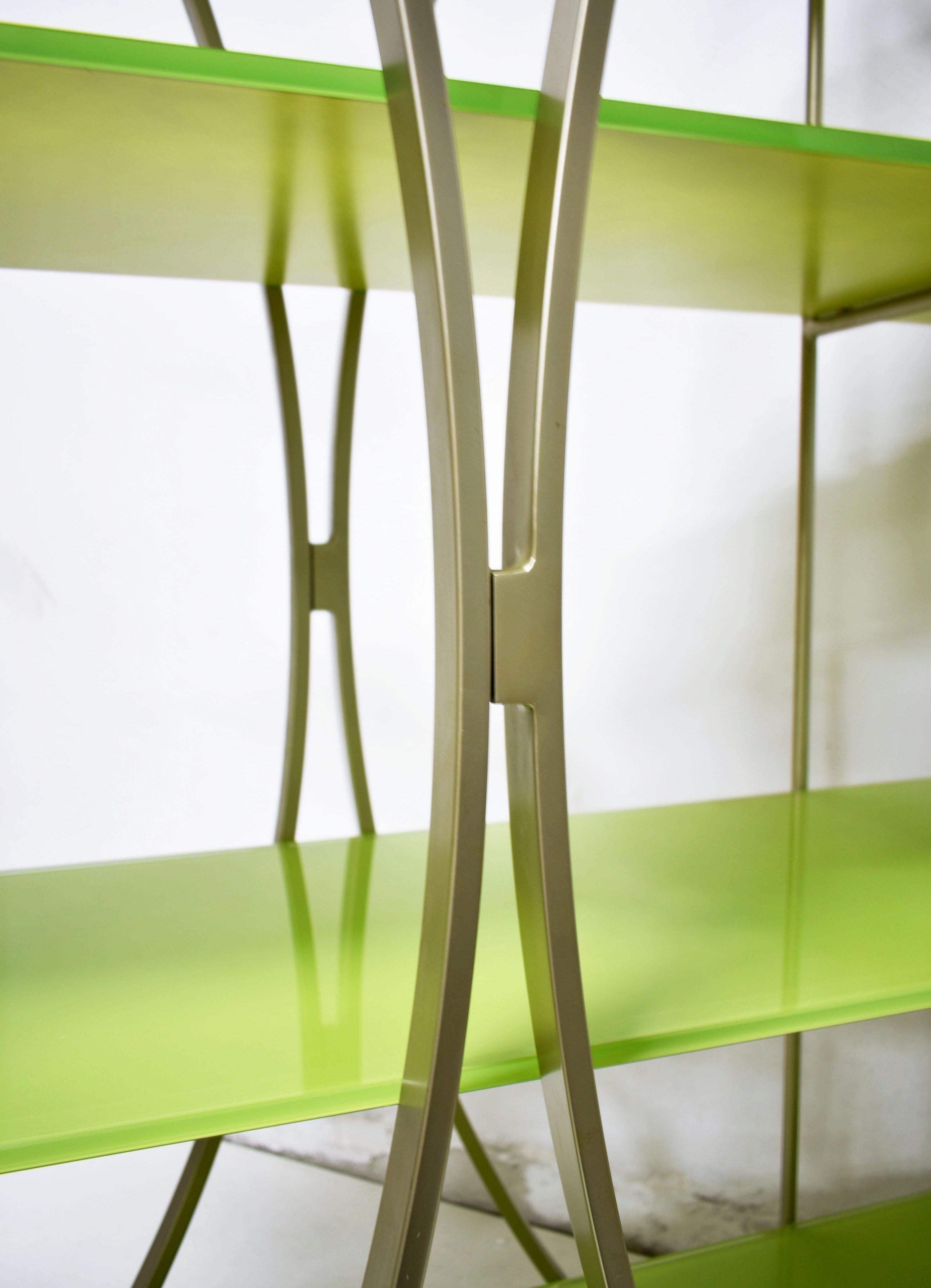Italian postmodern bookshelves produced in the 1980s and 1990s by Tonin Casa, Italy 

The stunning postmodern sculptural form of the bookshelves features a minimalist metal structure supporting 4 heavy weighted shelves made of tempered glass