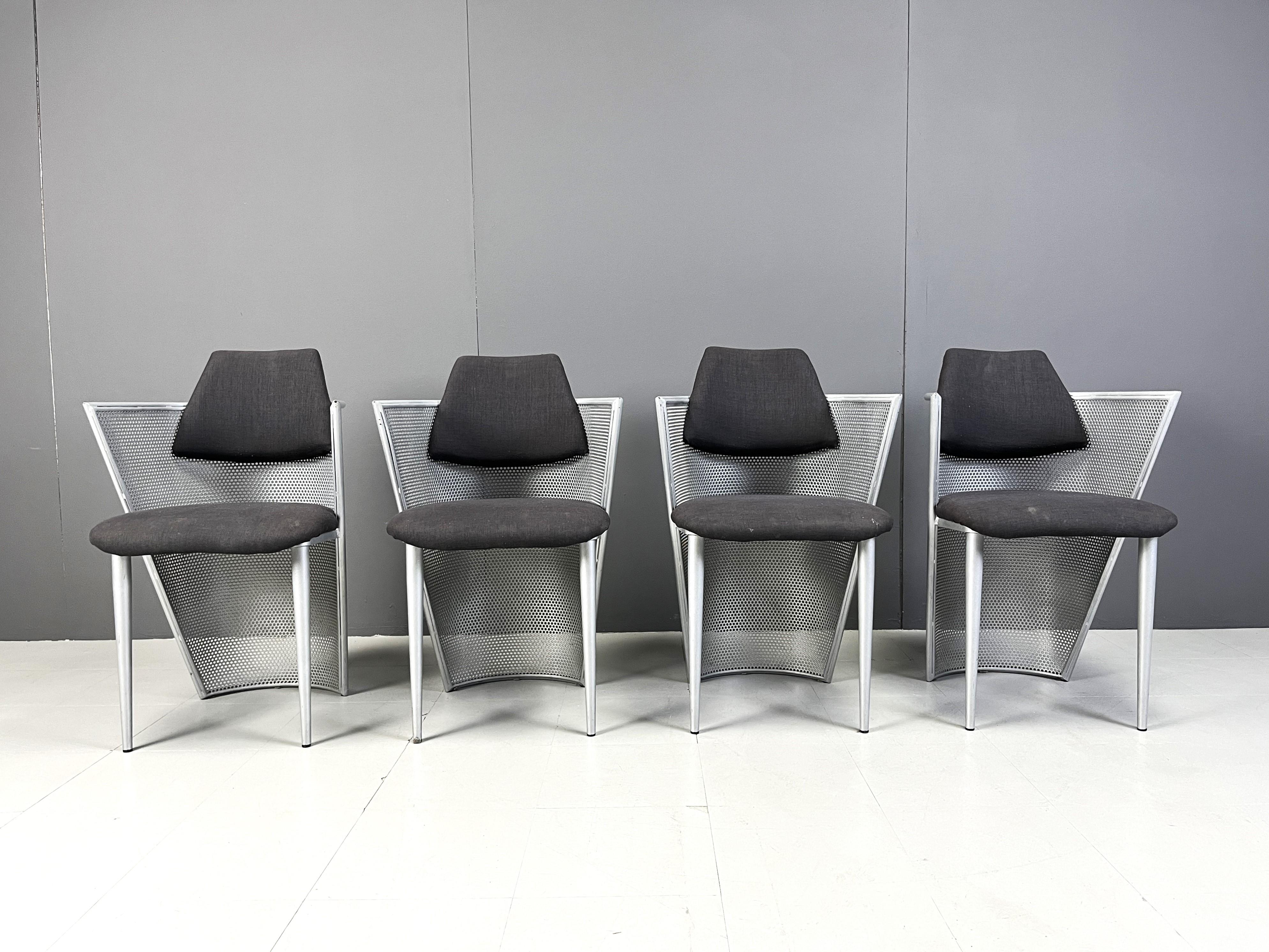 Set of 4 postmodern design armchairs/dining chairs made from a metal perforated frames and black fabric seats and backrests.

Timeless design

1980s - Belgium

Good condition

Dimensions:
Height: 84cm
Height armrests: 72cm
Seat height: 46cm
Width: