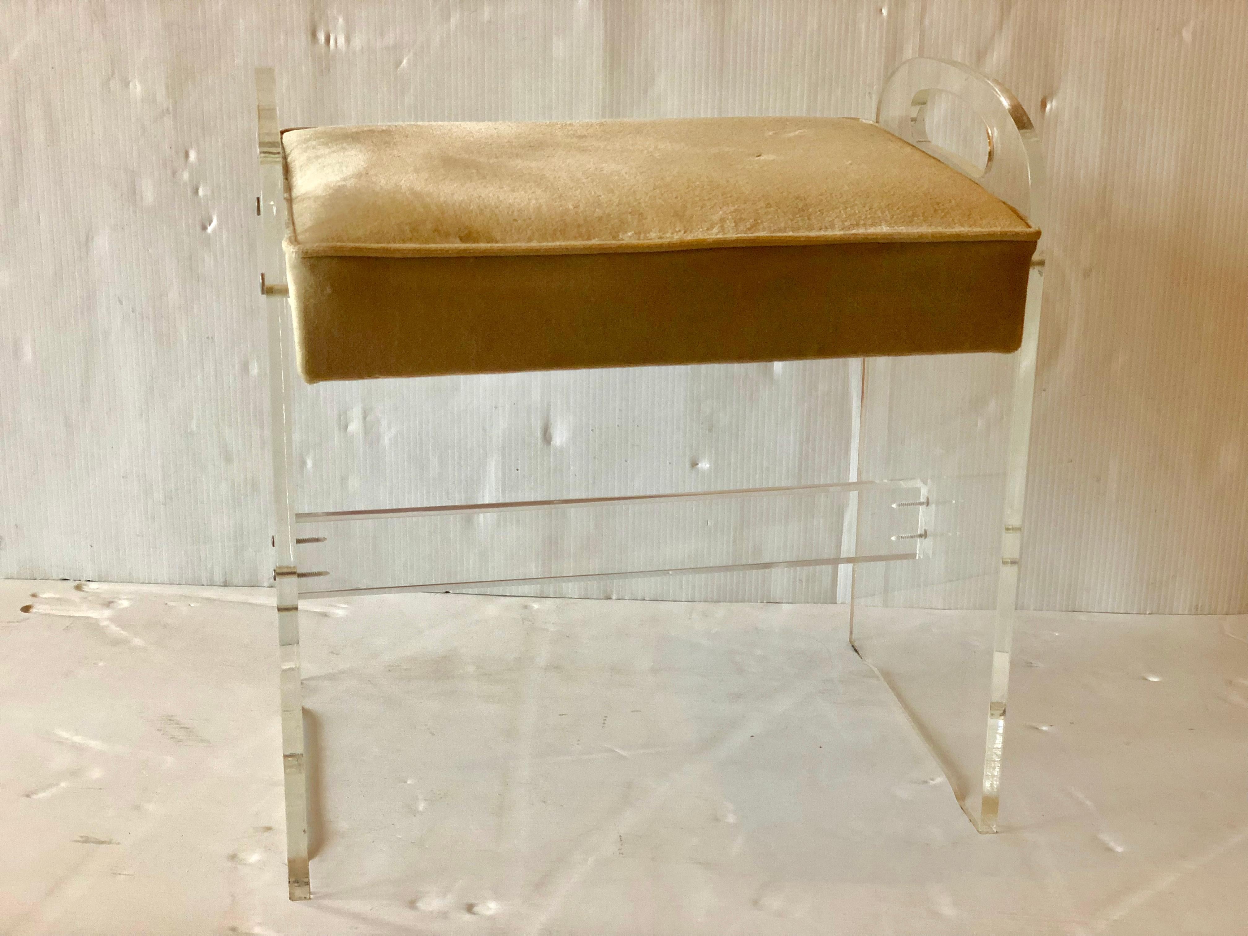 Versatile solid Lucite vanity stool, with side handles, circa 1970s. In white Naugahyde nice and clean condition original fabric cream velvet light wear.