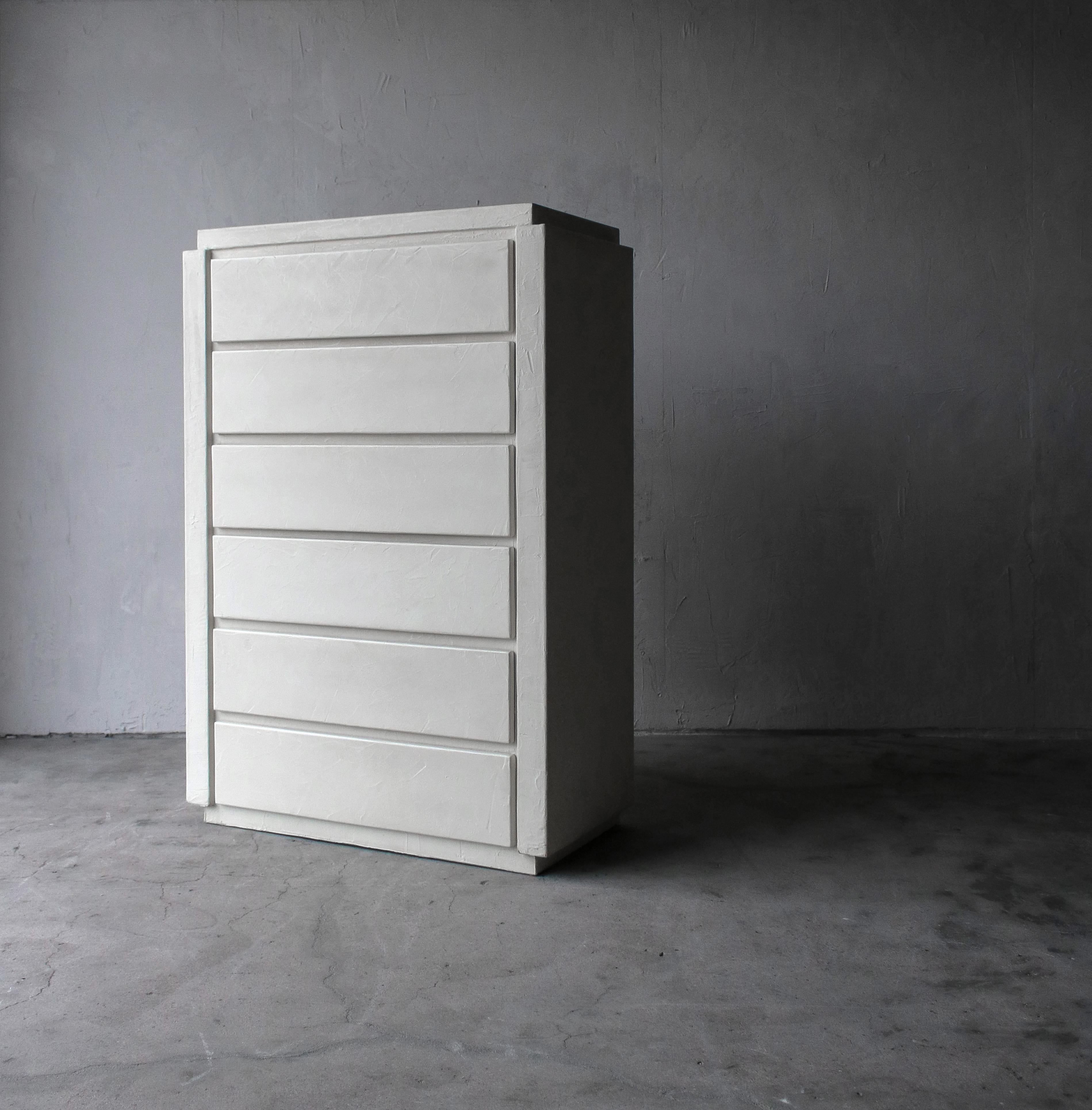 Wonderful Postmodern plaster high boy dresser. Dresser is very large and substantial standing 5ft tall and featuring 6 drawers for all your storage needs.

This set is so beautiful and right on trend with the Minimalist design that has become so