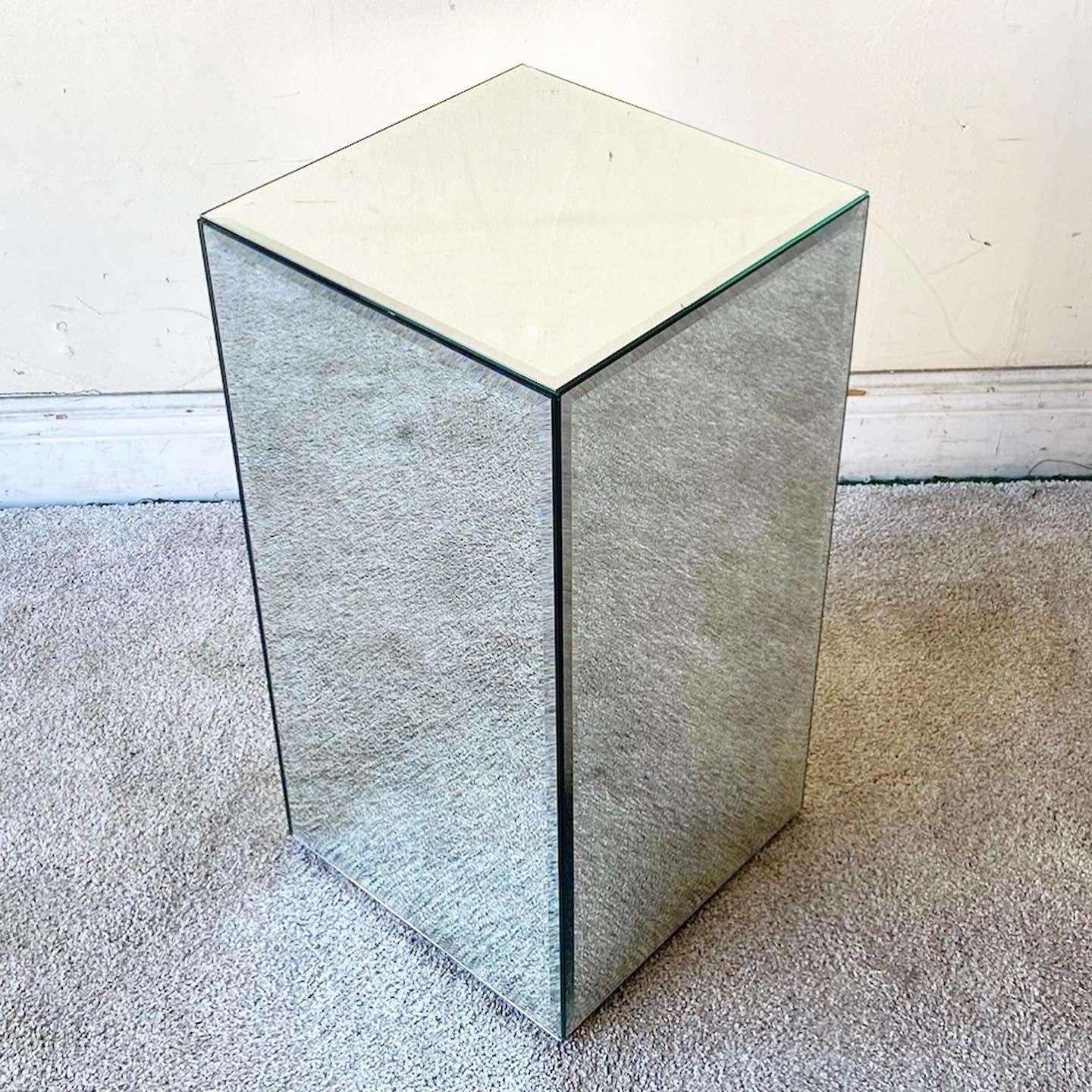 Amazing vintage Postmodern mirrored pedestal. Each side features a beveled mirror.