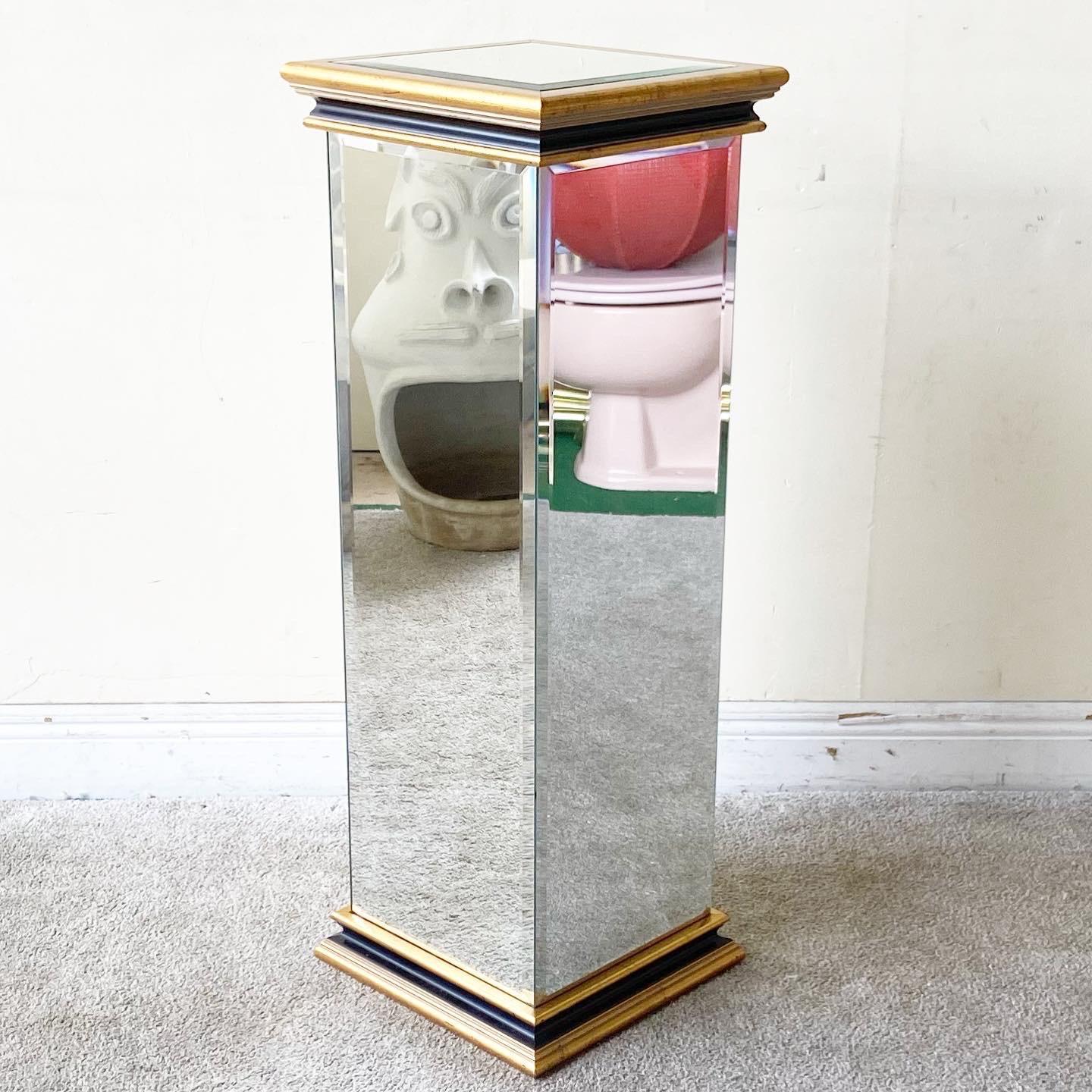 Incredible postmodern pedestal. Features mirrored sides and a top framed by a wooden border.
 