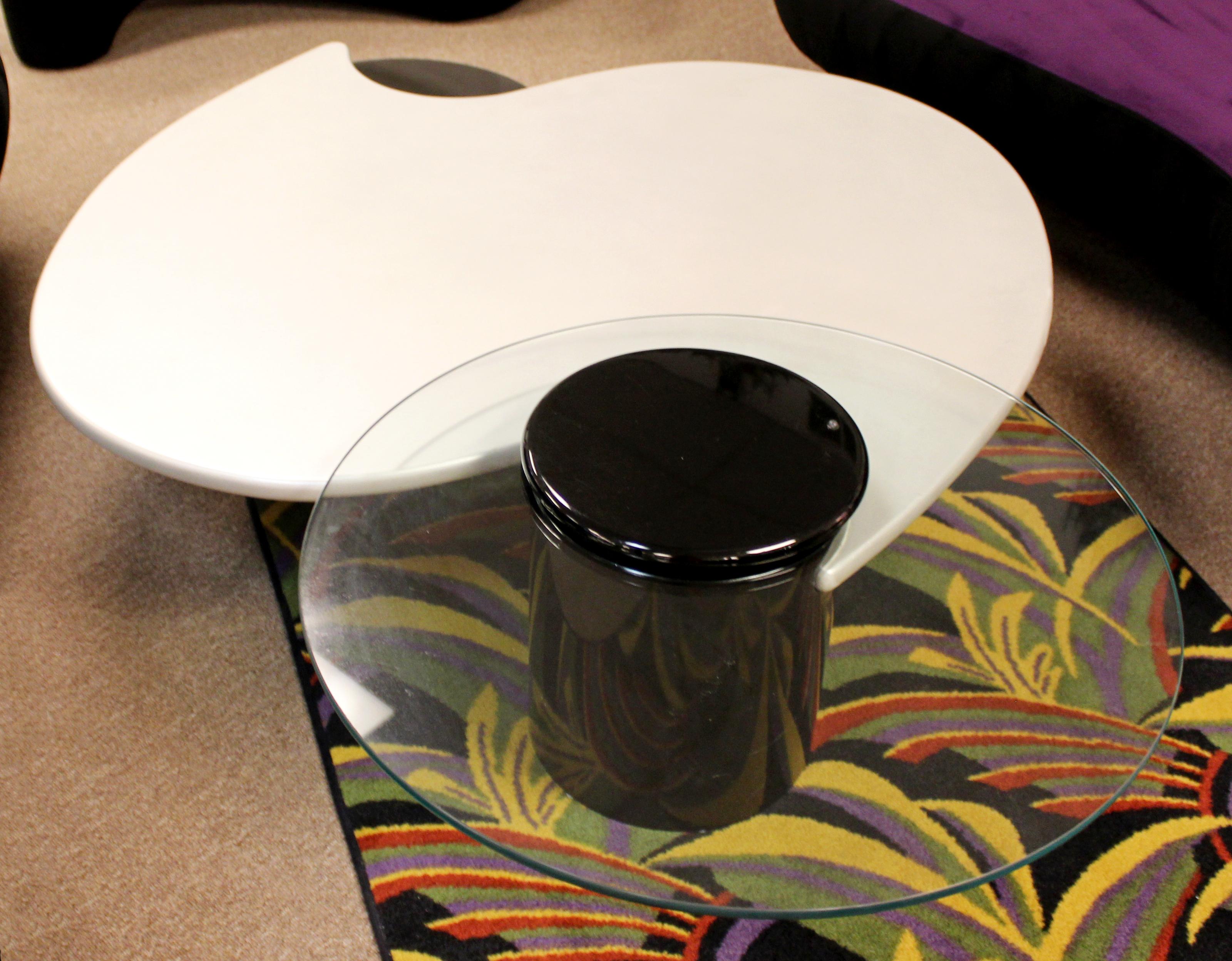 For your consideration is an appealingly luxe looking, asymmetrical, three tier coffee table by Rougier, made in Canada, circa the 1980s. The table is black gloss and repainted pearlize white lacquer with an articulating piece of glass, Lazy Susan