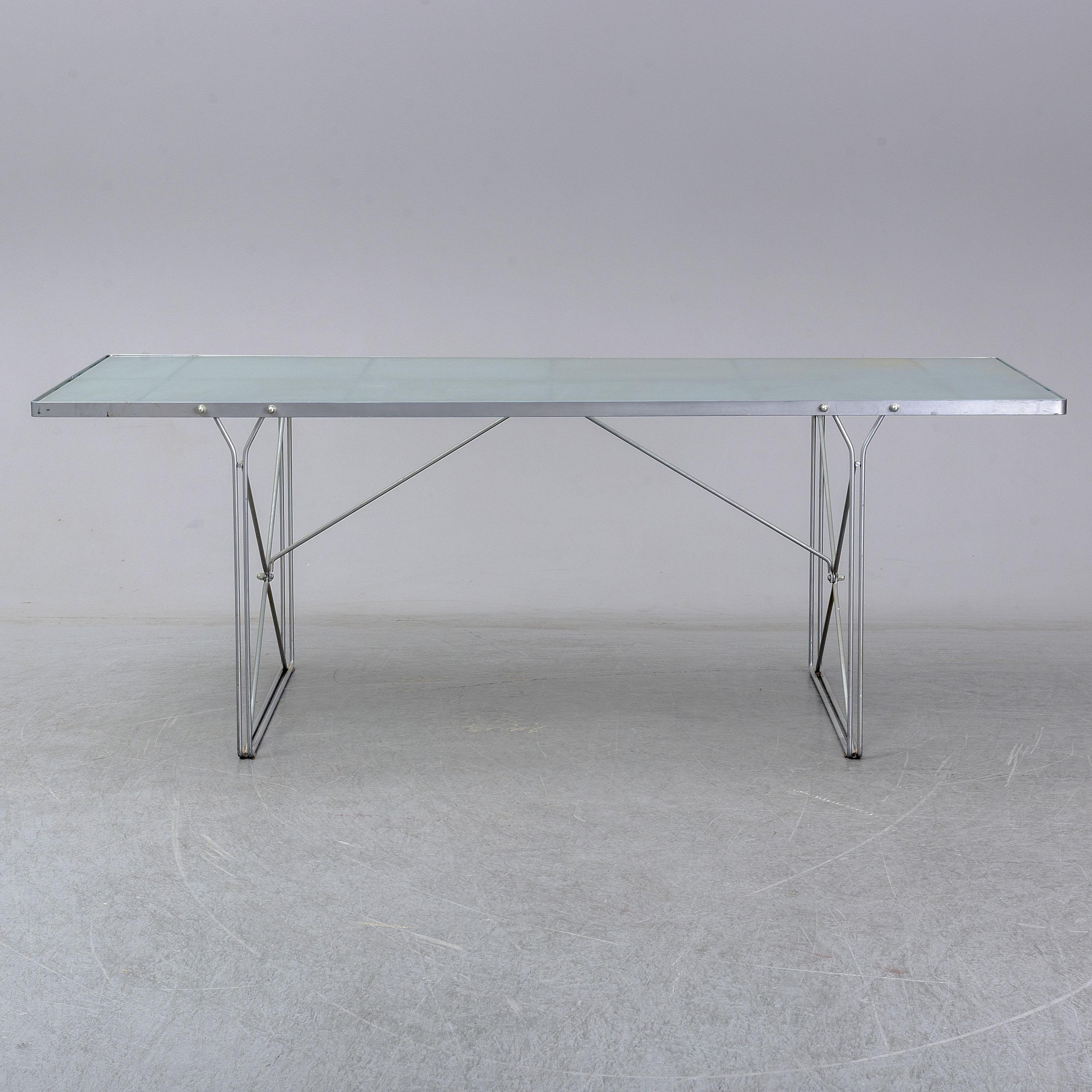 Vintage Ikea dining table from the iconic MOMENT collection by Niels Gammelgaard

Designed and manufactured in the 1980s


The table features a frosted glass top and powder-coated steel frame in matte grey color.

The table functions very