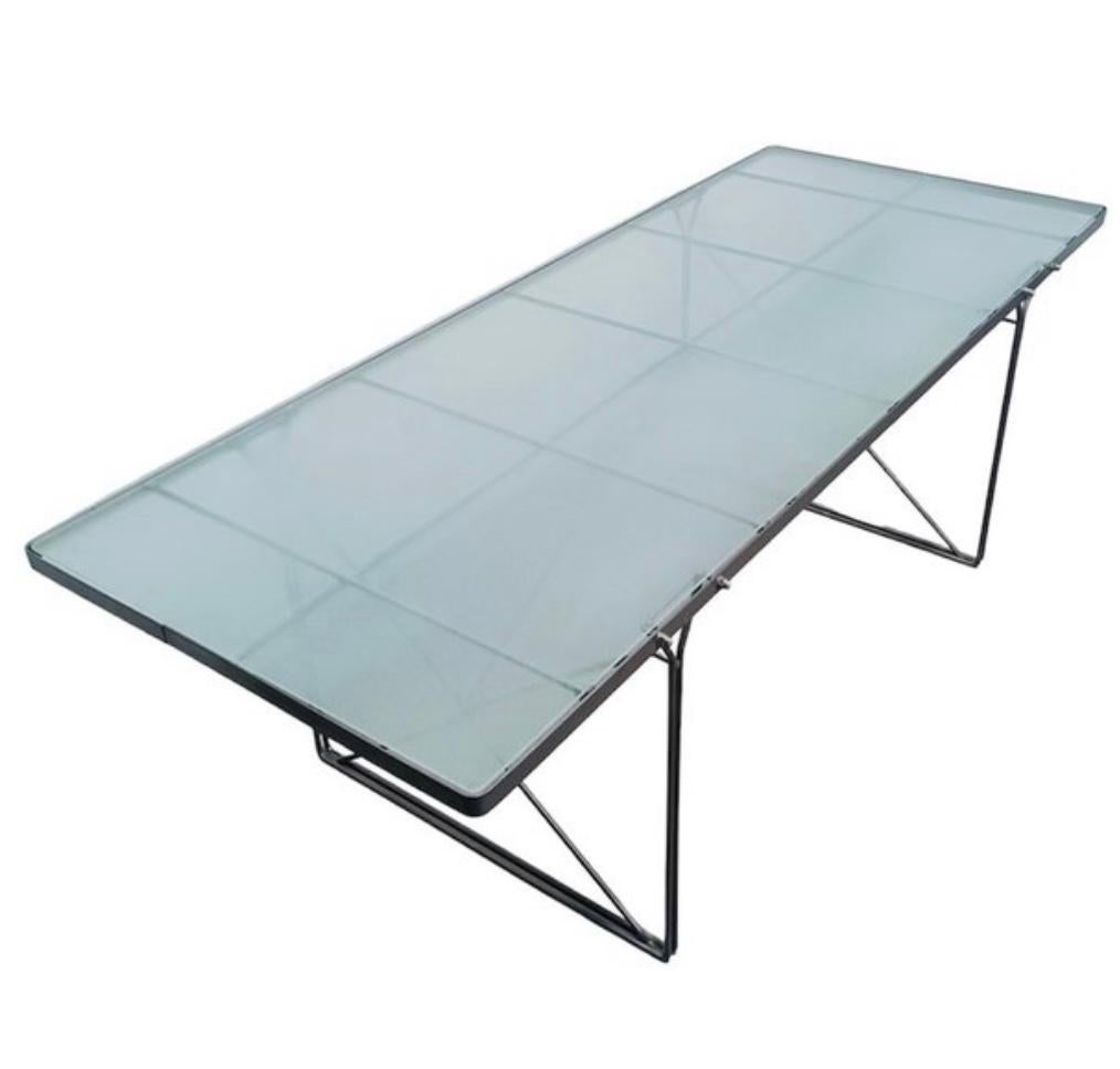 Vintage Ikea dining table from the iconic MOMENT collection by Niels Gammelgaard, designed and manufactured in the 1990s. 
The table features a frosted glass top and powder-coated steel frame in matte grey color.
In very good condition, there are