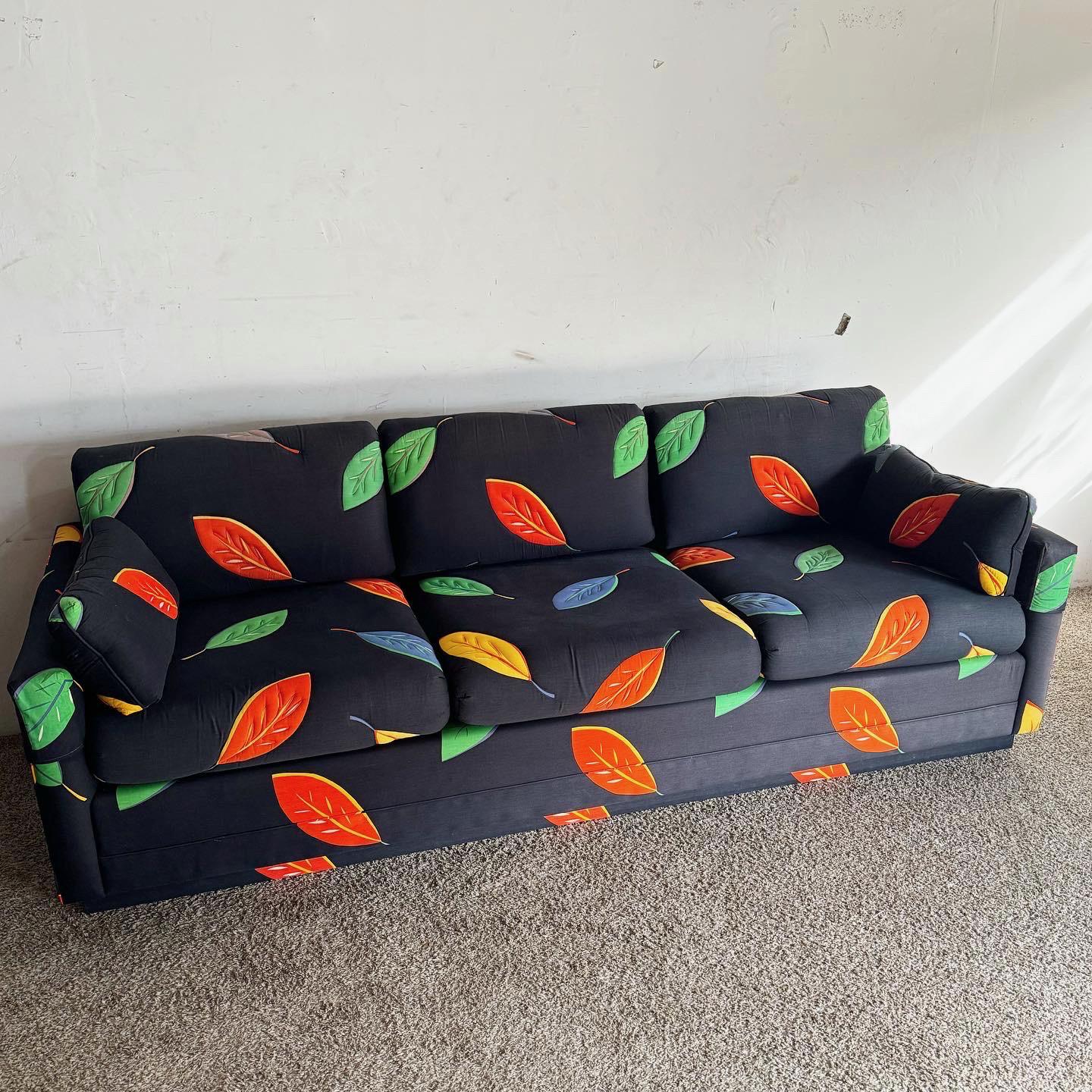 The Postmodern Multi Color Leaf/Black Fabric Sofa is a dynamic addition to any modern space. Featuring a vibrant leaf pattern against a black backdrop, this sofa combines postmodern style with comfort, perfect for creating a lively focal point in