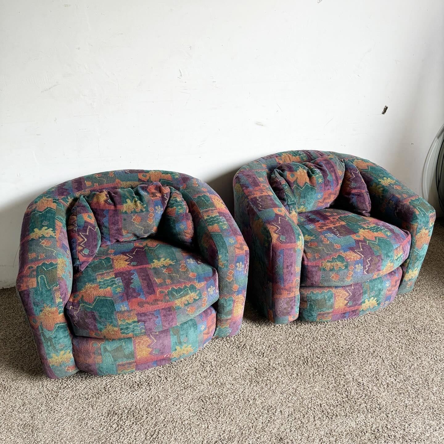 Embrace the boldness of postmodern design with these Multicolor Patterned Barrel Swivel Chairs. Upholstered in lively Memphis-style fabric, these chairs feature a mix of purple, pink, blue, and additional vibrant patterns. The barrel design and