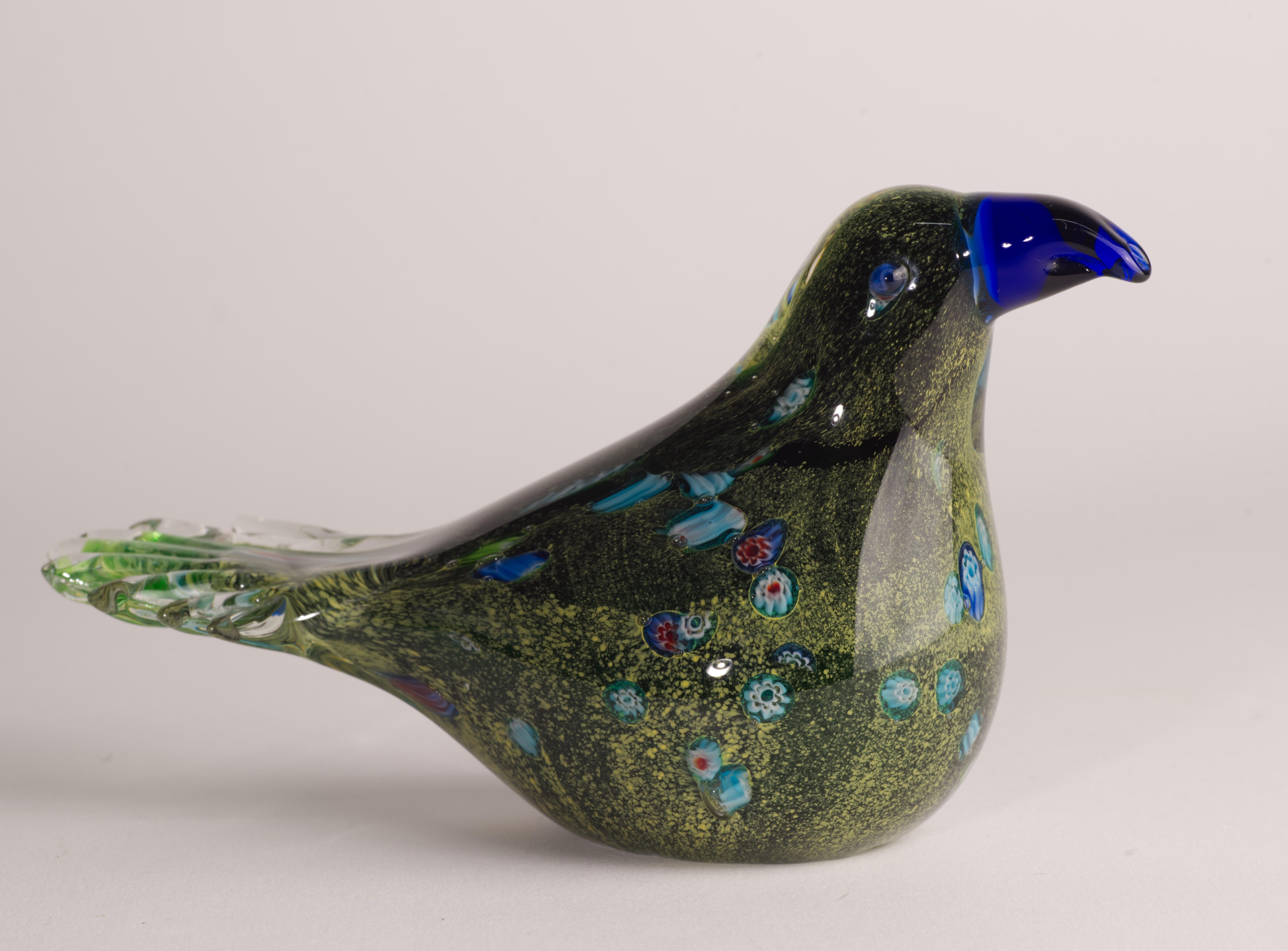  Playful bird figurine or paperweight is made in sommerso technique; speckled green and yellow colored glass gather with inclusions of multicolored millefiori canes is cased over with clear glass. Free-flowing pigments and fused canes in colored
