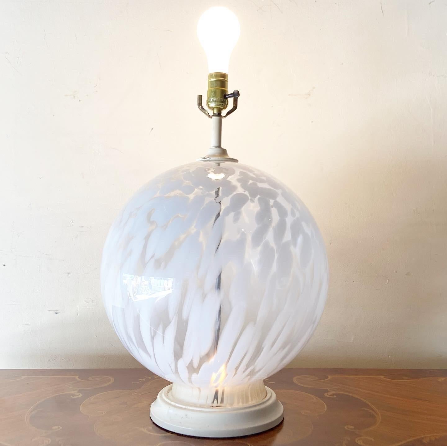 Exceptional postmodern Italian Murano glass table lamp. Features a large spherical white and transparent body.

4 settings: both lights, top light, bottom light, off
