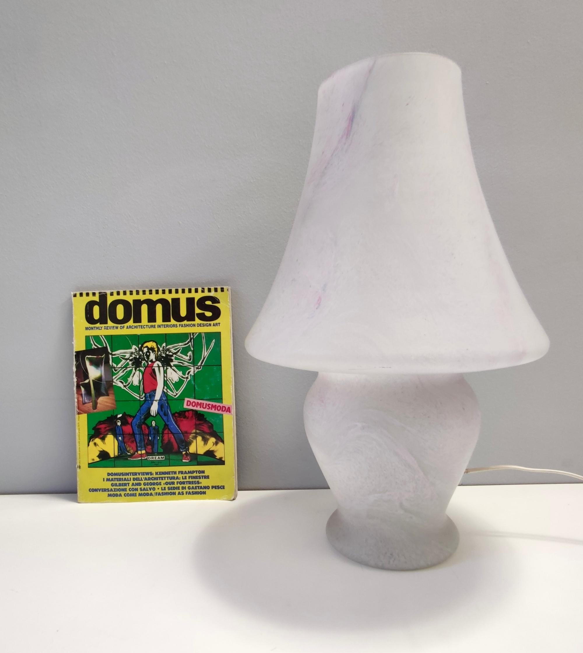 Made in Italy, 1970s. 
It is made in Murano glass with a pink marble effect.
This lamp might show slight traces of use since it's vintage, but it can be considered as in excellent original condition and ready to give ambiance to any room.